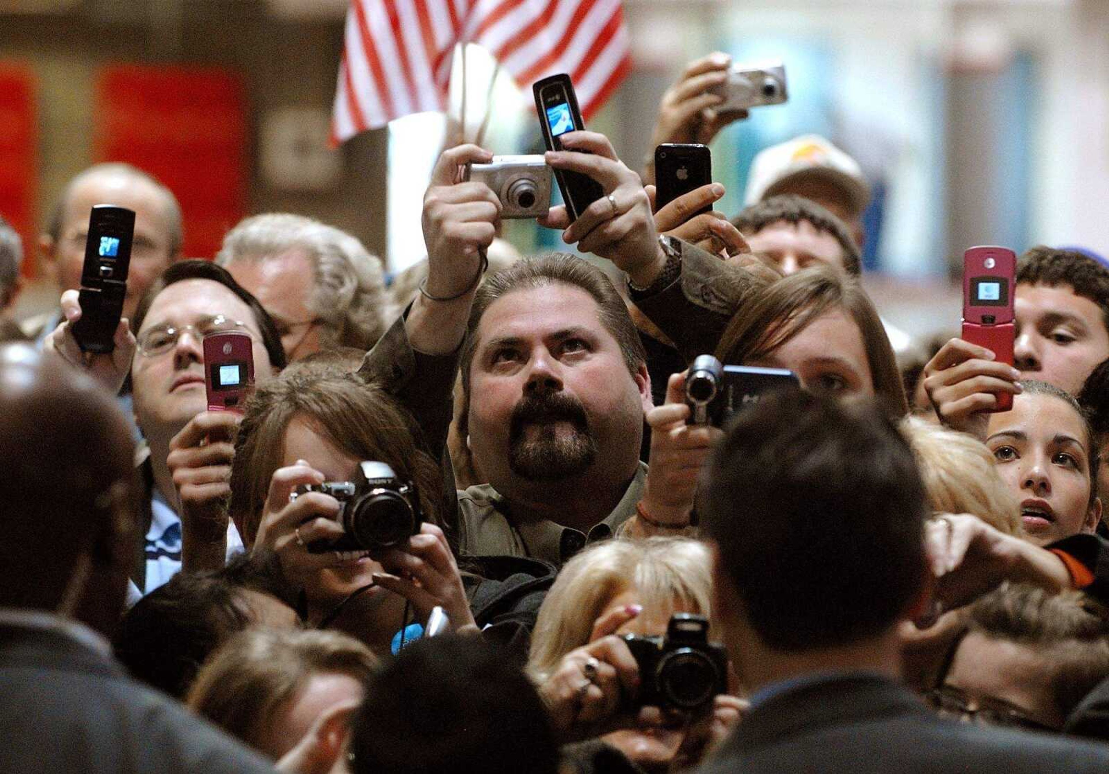 AARON EISENHAUER ~ aeisenhauer@semissourian.com
Crowd members crane with cameras and cell phones to get a picture of Alaska Governor Sarah Palin as she makes her exit from the Show Me Center.