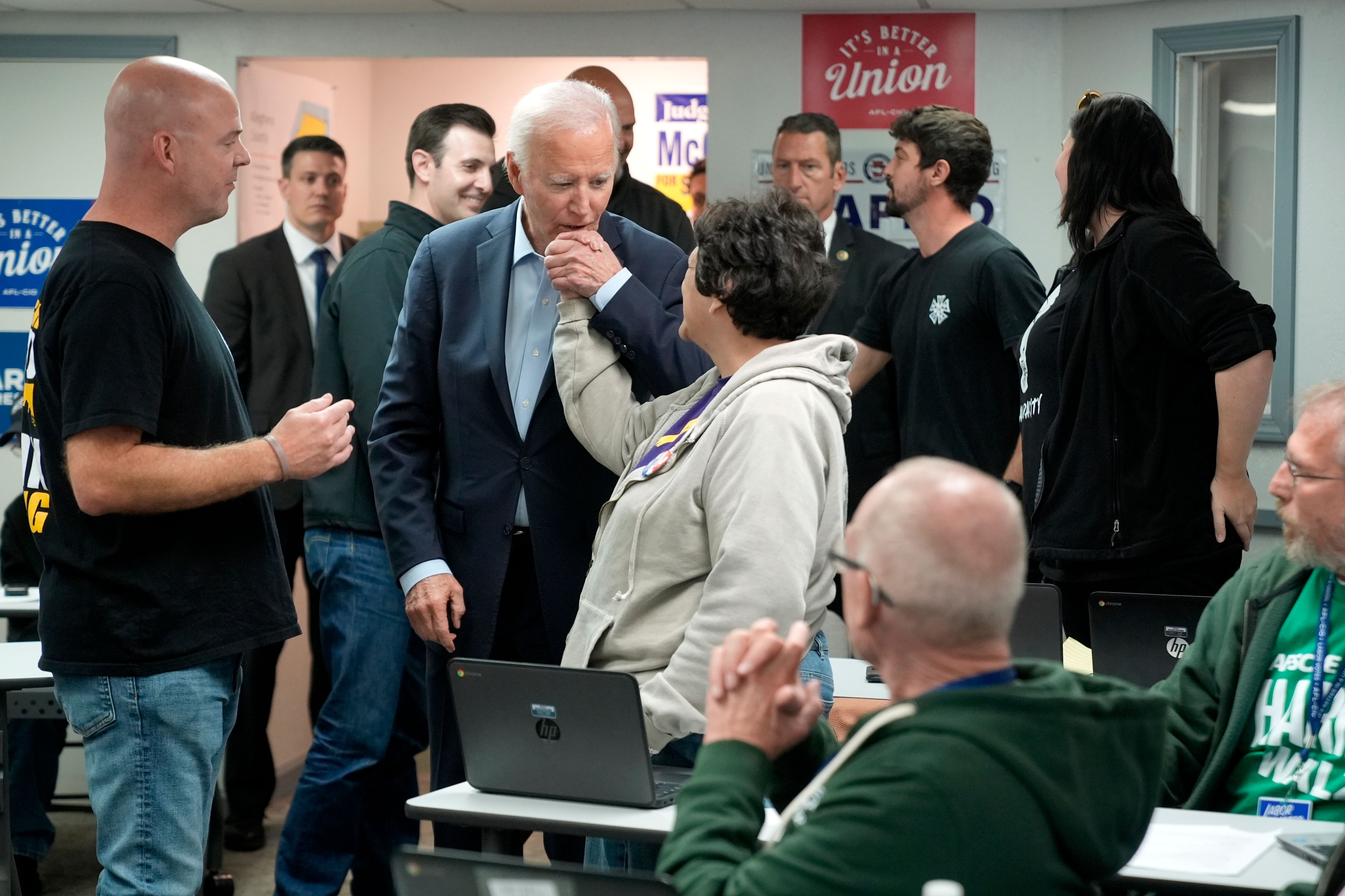 President Joe Biden, center left, greets a worker at a campaign event with union workers at the Steamfitters Technology Center in Pittsburgh, Saturday, Oct. 26, 2024. (AP Photo/Manuel Balce Ceneta)