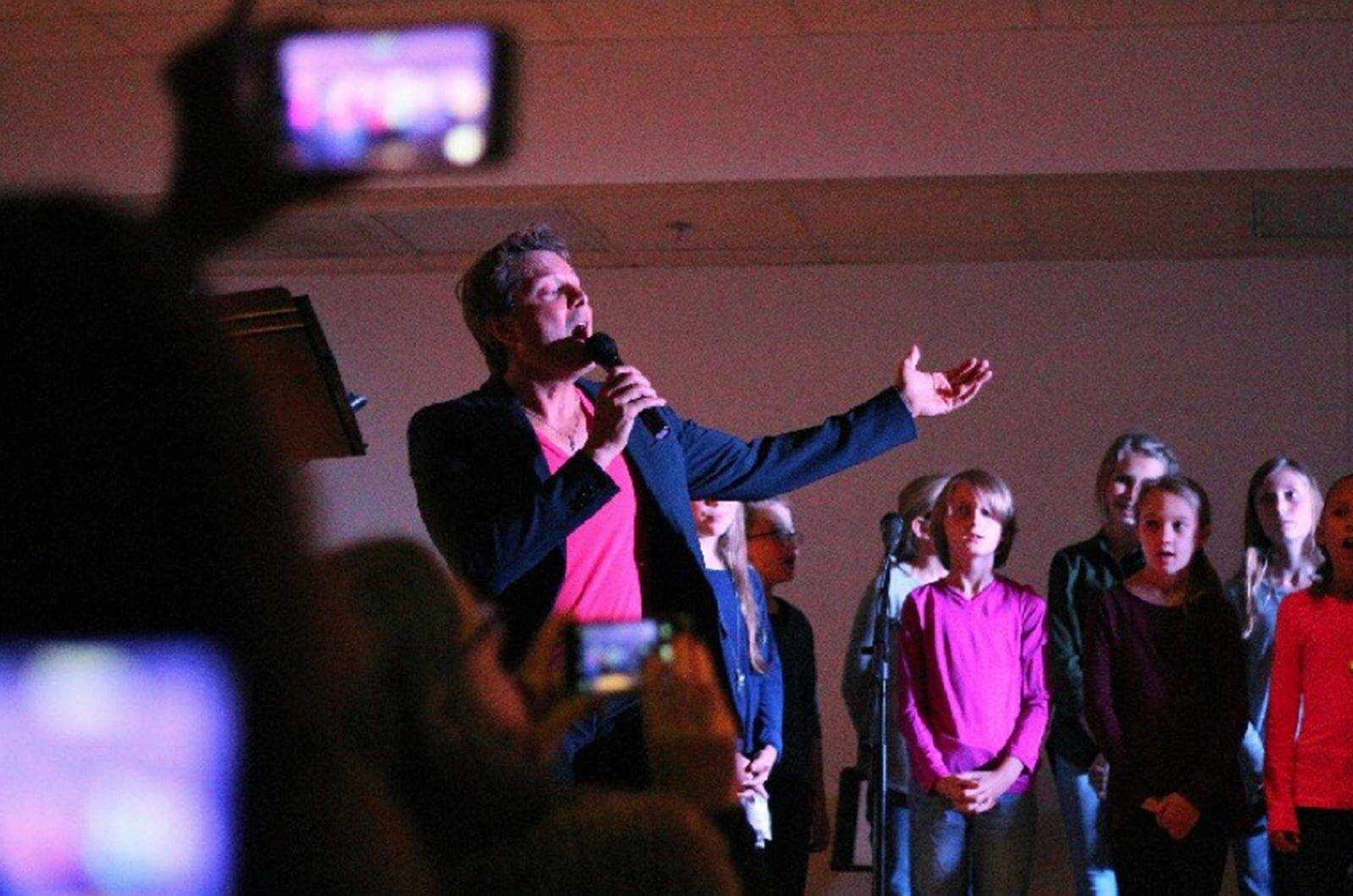 Singer Steph Carse and the Immaculate Conception School Choristers sing Leonard Cohen's "Hallelujah" during a concert Sunday at the Osage Centre.