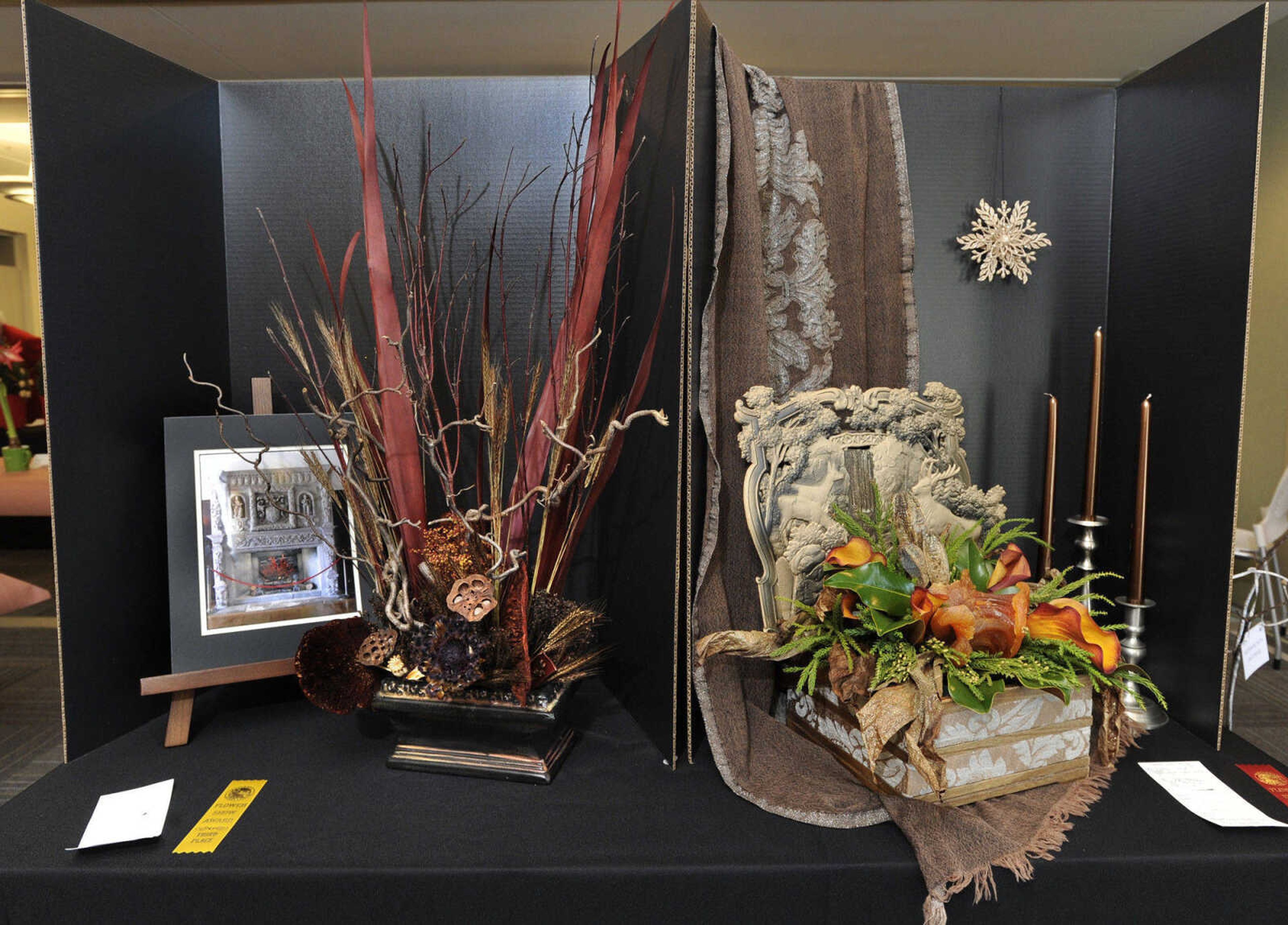 Left: A still life by Elena Perryman, Ramblewood Garden Club, third place; right: Duane Foster, Four Seasons Garden Club, second place.