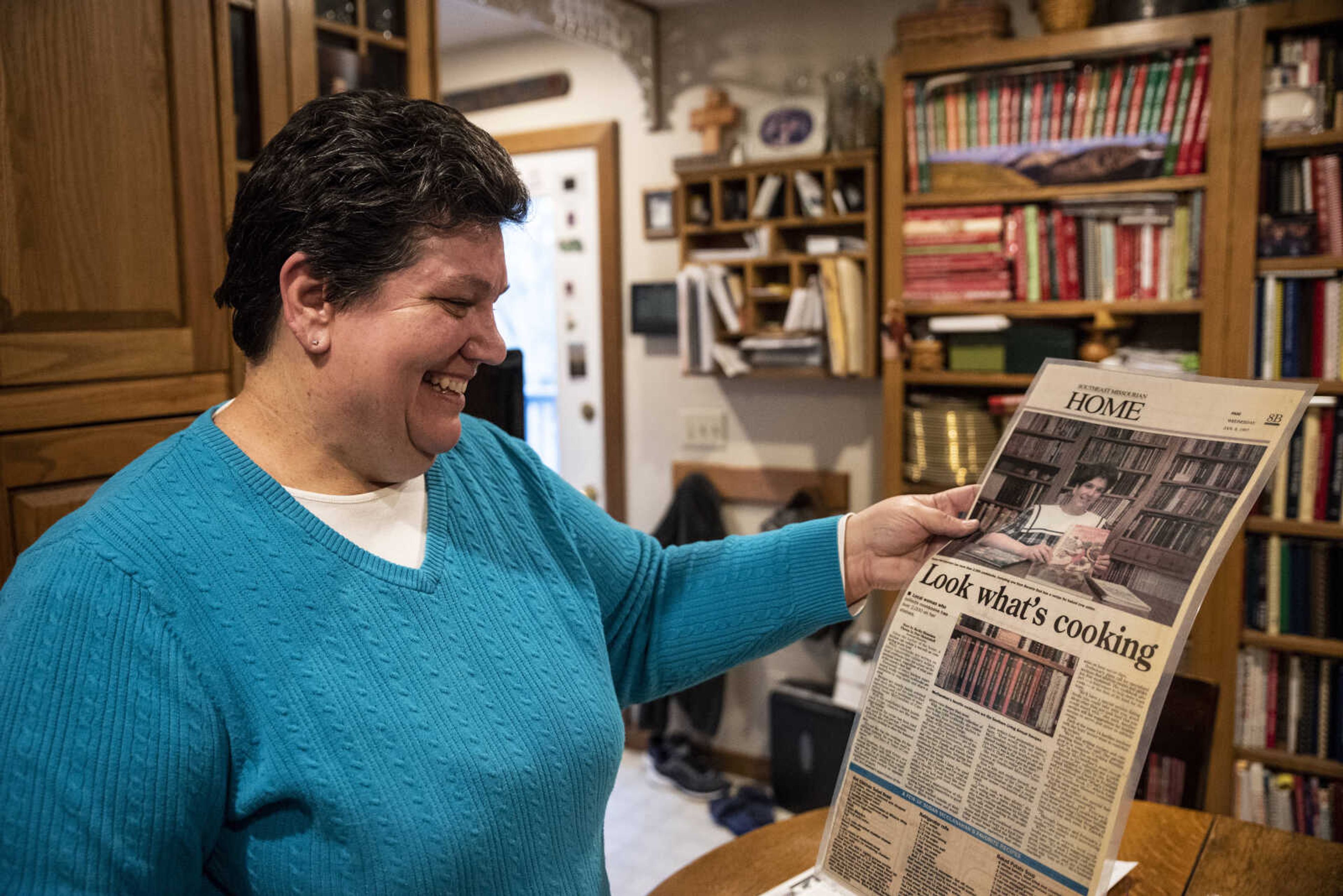 Susan McClanahan looks at a laminated column featuring herself from Jan. 8, 1997, while at her home  Tuesday, Nov. 27, 2018, in Cape Girardeau.