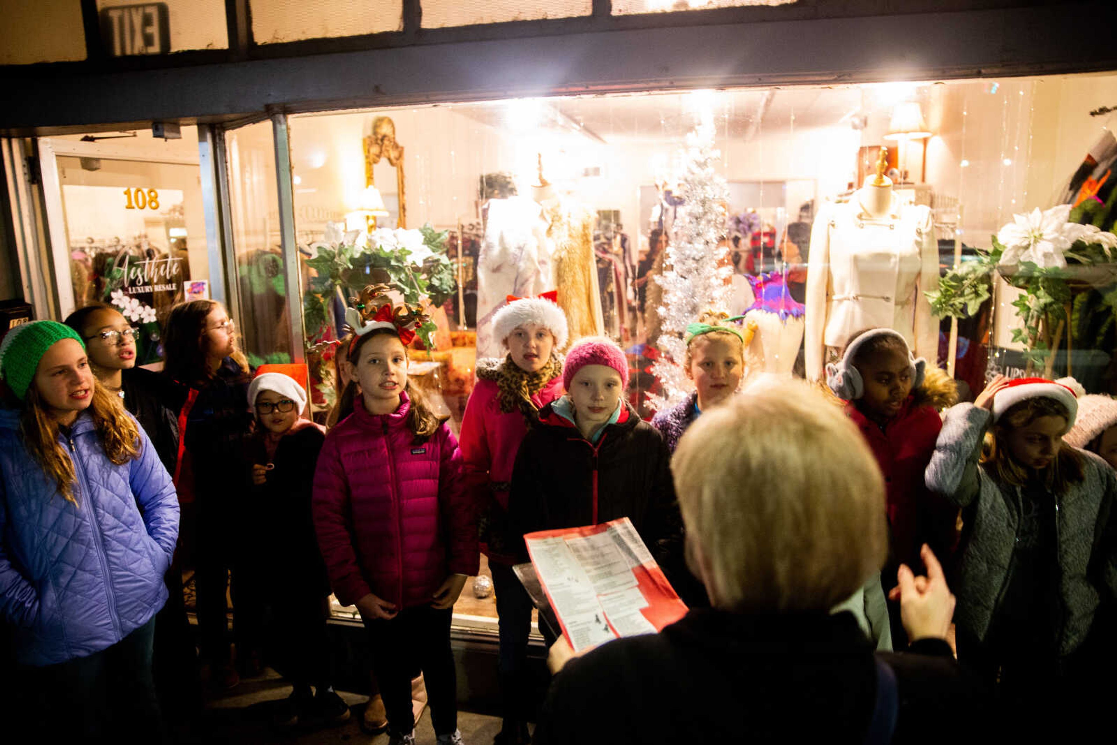 Rebecca Gentry leads the 4th grade choir from Alma Schrader Elementary School as they carol along Main Street&nbsp;&nbsp;on Friday, Dec. 2 in downtown Cape Girardeau.