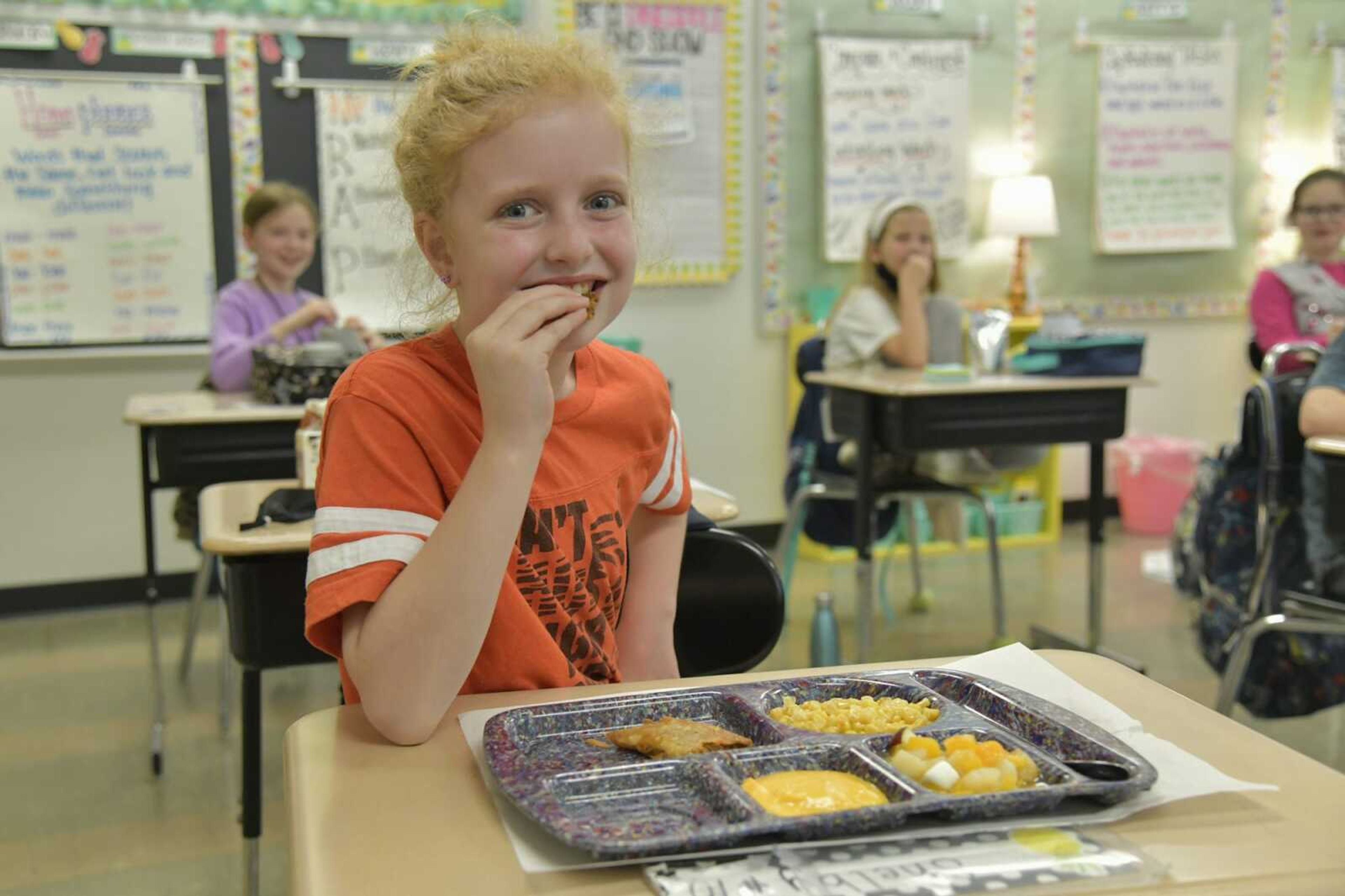 Third-grader Shelby Matukewicz eats a crispito for lunch at Alma Schrader Elementary School on Thursday in Cape Girardeau.