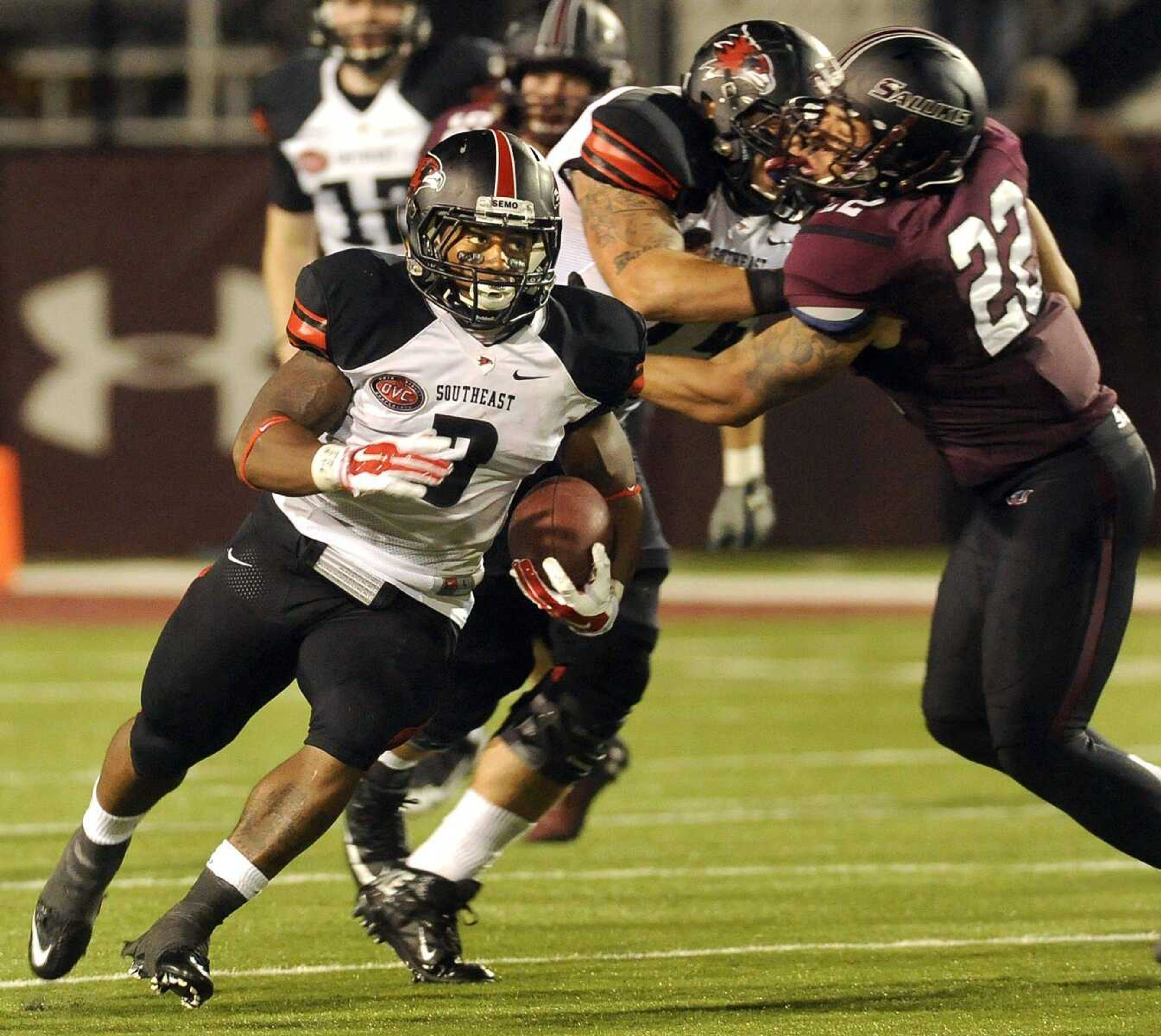 Southeast Missouri State wide receiver Peter Lloyd carries past Southern Illinois' Jordan Poole during the second quarter Saturday, Sept. 13, 2014 in Carbondale, Ill. (Fred Lynch)