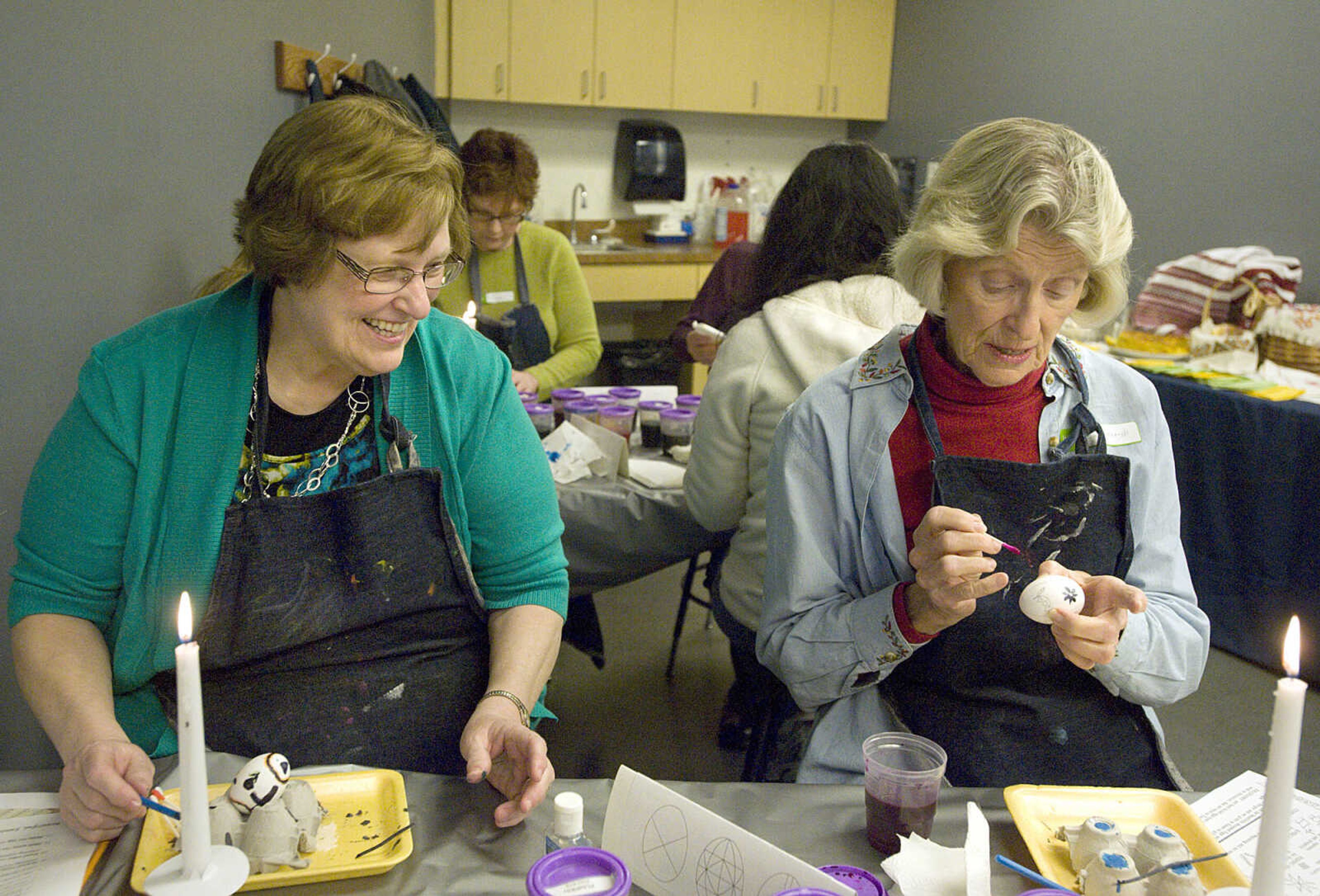 LAURA SIMON ~ lsimon@semissourian.com
Gail Crader, left, and Judy Holcomb apply dye to their eggs Tuesday, March 19, 2013 during the Wonderful World of Pysanky workshop at Southeast Missouri State University's River Campus.