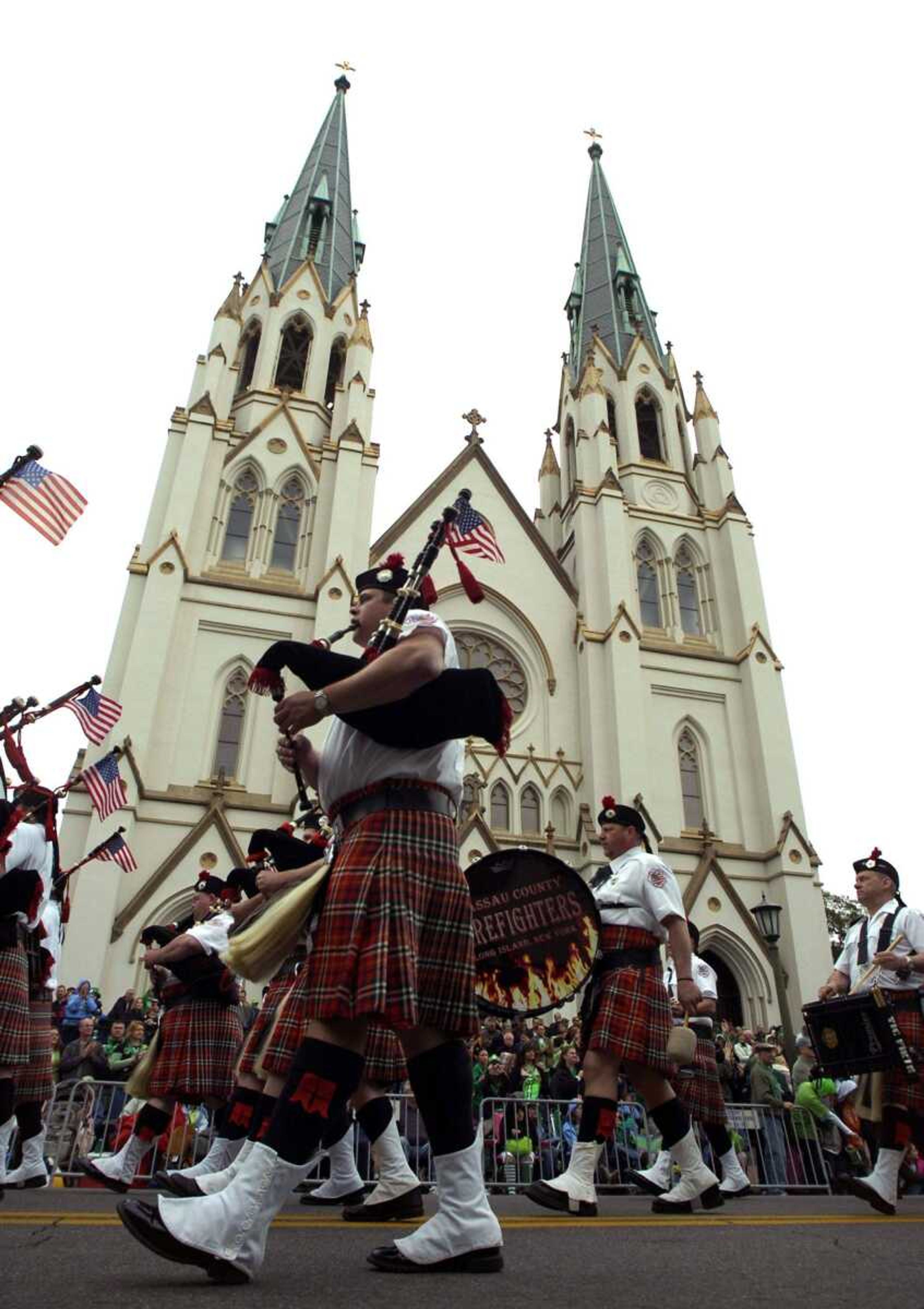 Members of the Nassau County, N.Y., Firefighters Pipes and Drums march past the Cathedral of St. John the Baptist in the 183rd St. Patrick's Day parade Wednesday in Savannah, Ga. The St. Patrick's Day celebration is the city's largest annual celebration and one of the largest St. Patrick's Day events in the nation. (STEPHEN MORTON ~ Associated Press)