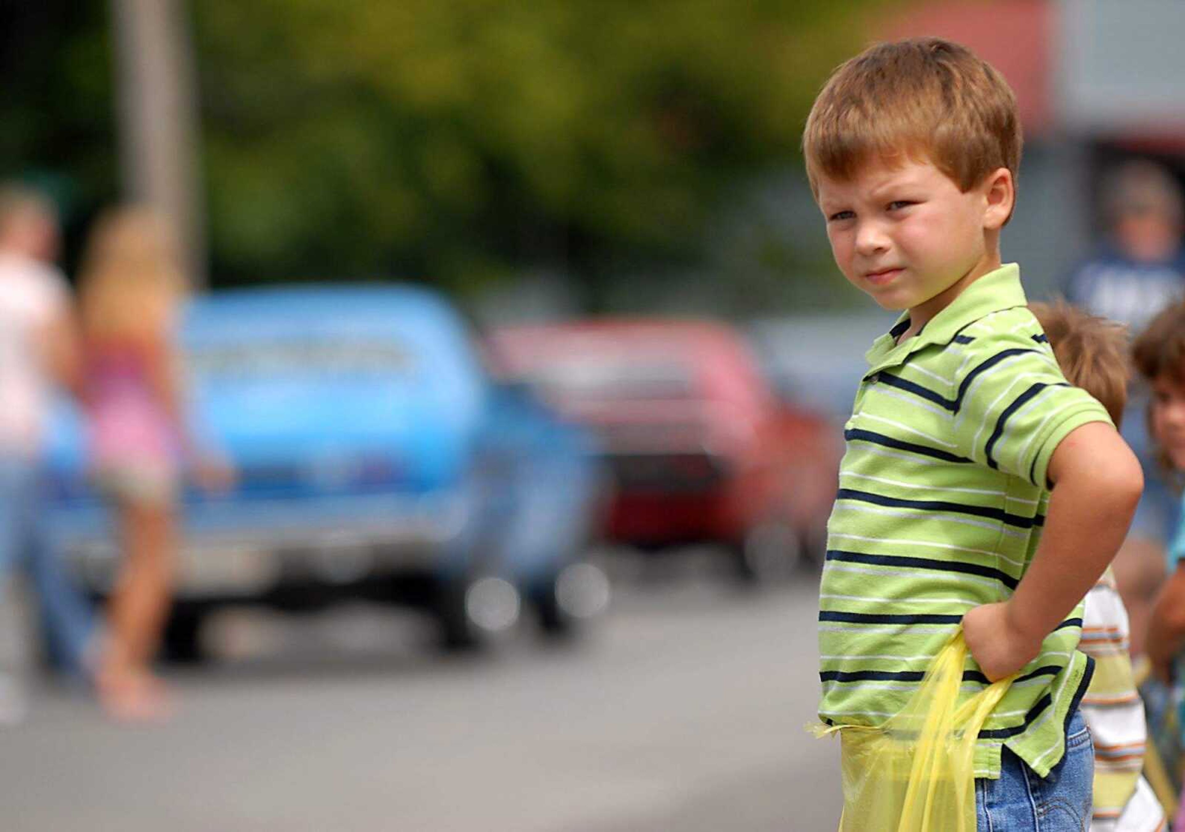 AARON EISENHAUER ~ aeisenhauer@semissourian.com
Kyran Newell, 6, waits with bag in hand for the next float to throw candy during the East Perry County Fair on Friday, September 19, 2008.