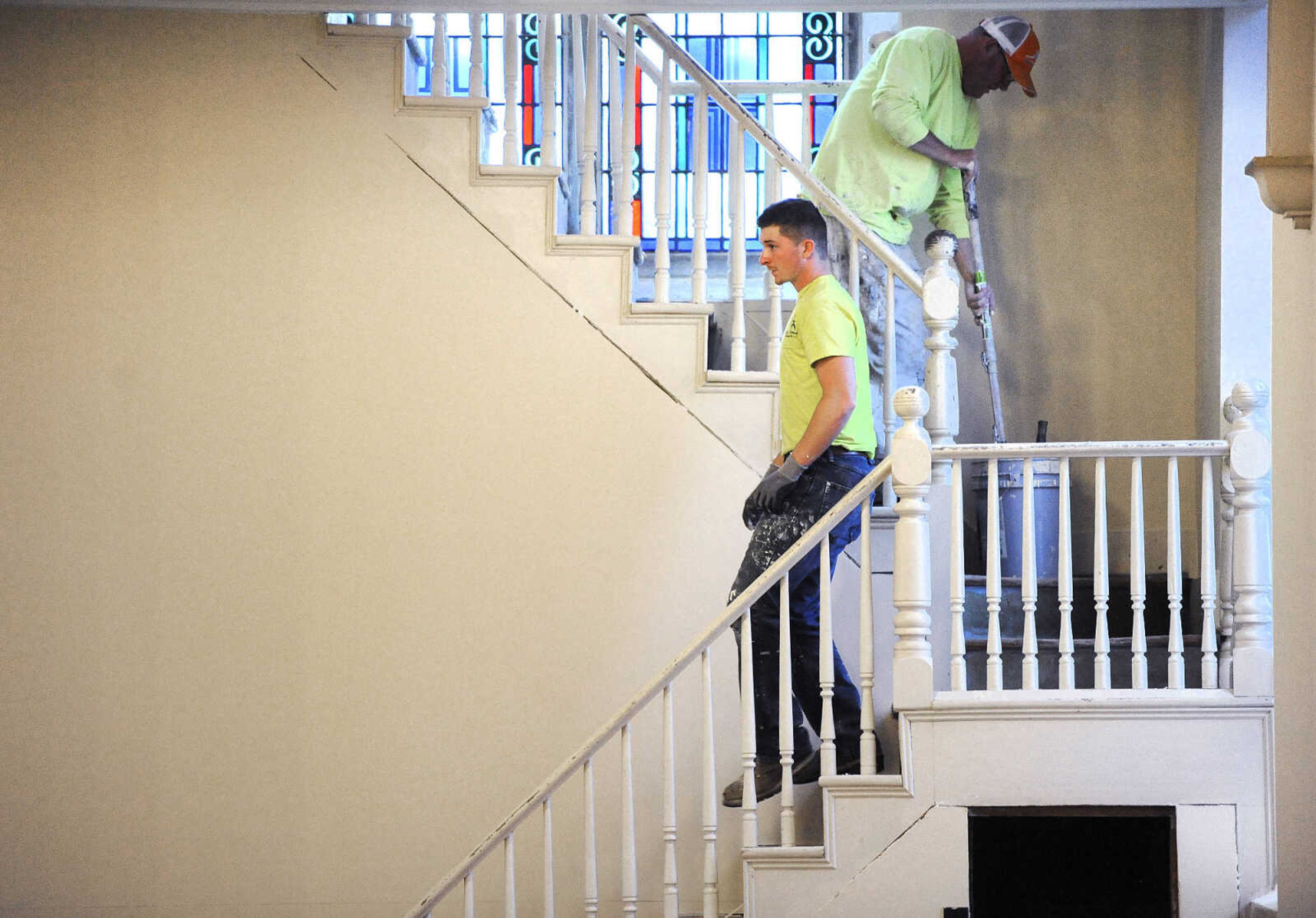 LAURA SIMON ~ lsimon@semissourian.com

Kyle Thompson heads down the choir loft stairs past Brad Earnhardt inside St. John's Catholic Church in Leopold, Missouri on March 3, 2016.