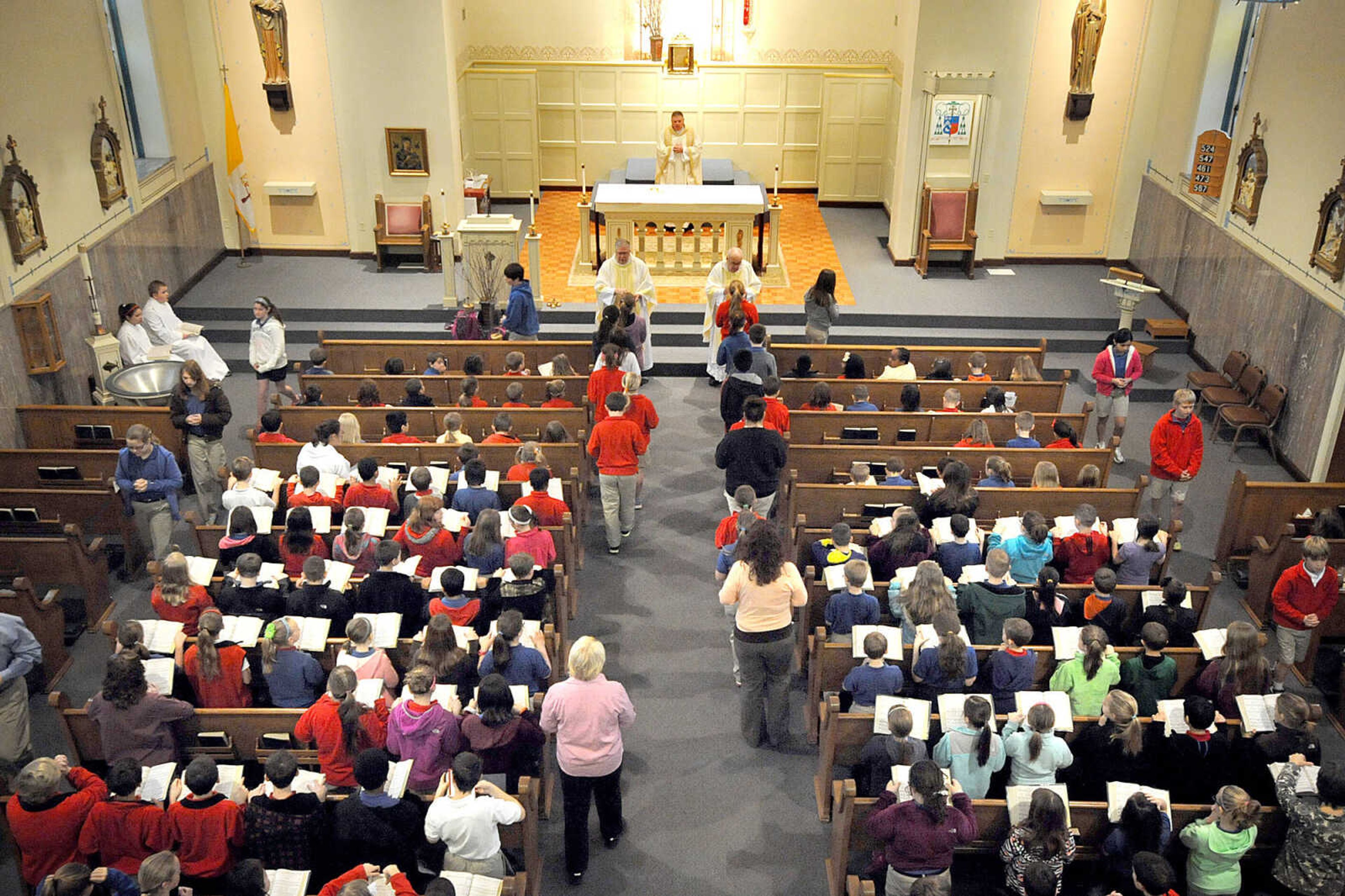 LAURA SIMON ~ lsimon@semissourian.com
Parishioners and students receive the Eucharist Friday morning, March 15, 2013 during the Mass of Thanksgiving at St. Mary's Cathedral in Cape Girardeau. The mass was in honor of the election of Pope Francis I.