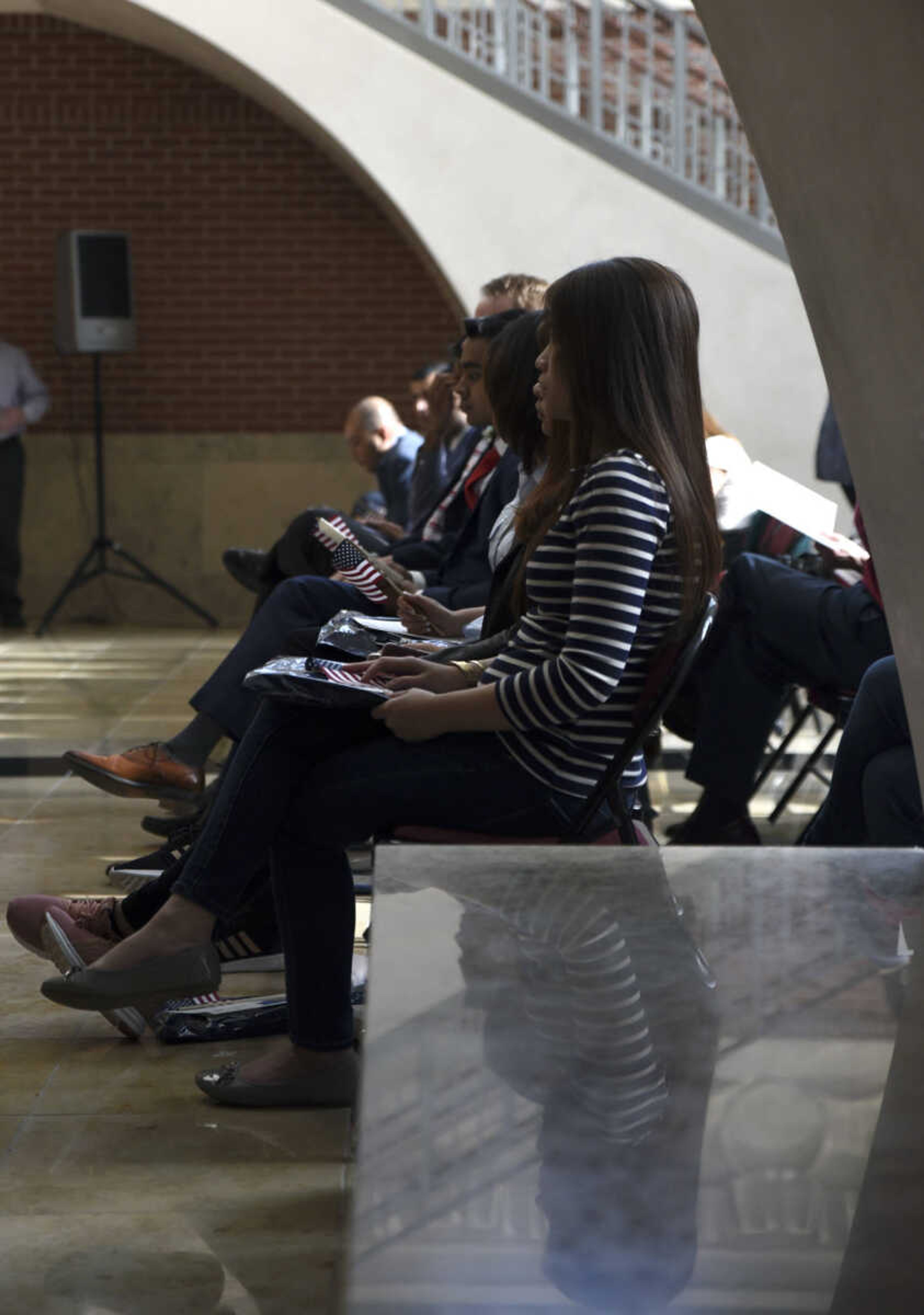 Candidates for American citizenship wait before the start of the United States District Court Eastern District of Missouri Southeastern Division's naturalization ceremony on Friday, April 6, 2018, at the Rush Hudson Limbaugh, Jr., United States Courthouse in Cape Girardeau.