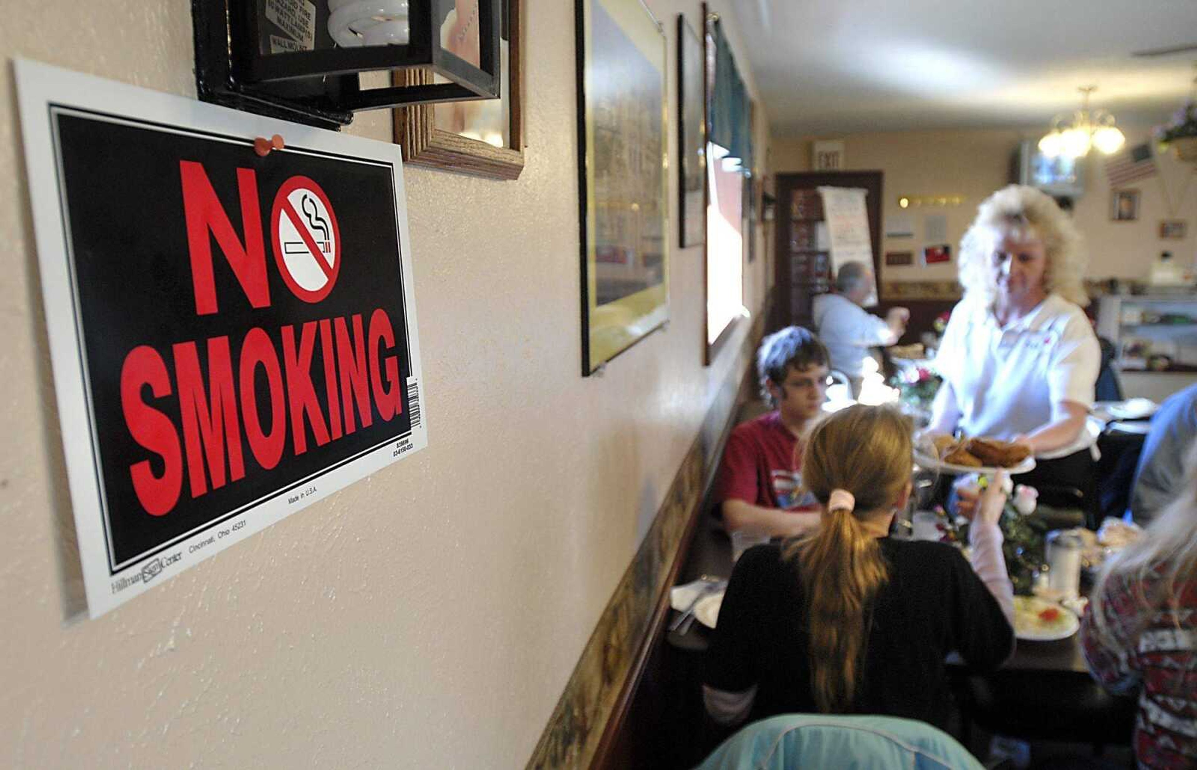 The Rose Garden restaurant in East Cape Girardeau, Ill., increased its no-smoking tables to 100 percent with the new Illinois smoking law taking effect. A sign remained from the former nonsmoking section. (Fred Lynch)