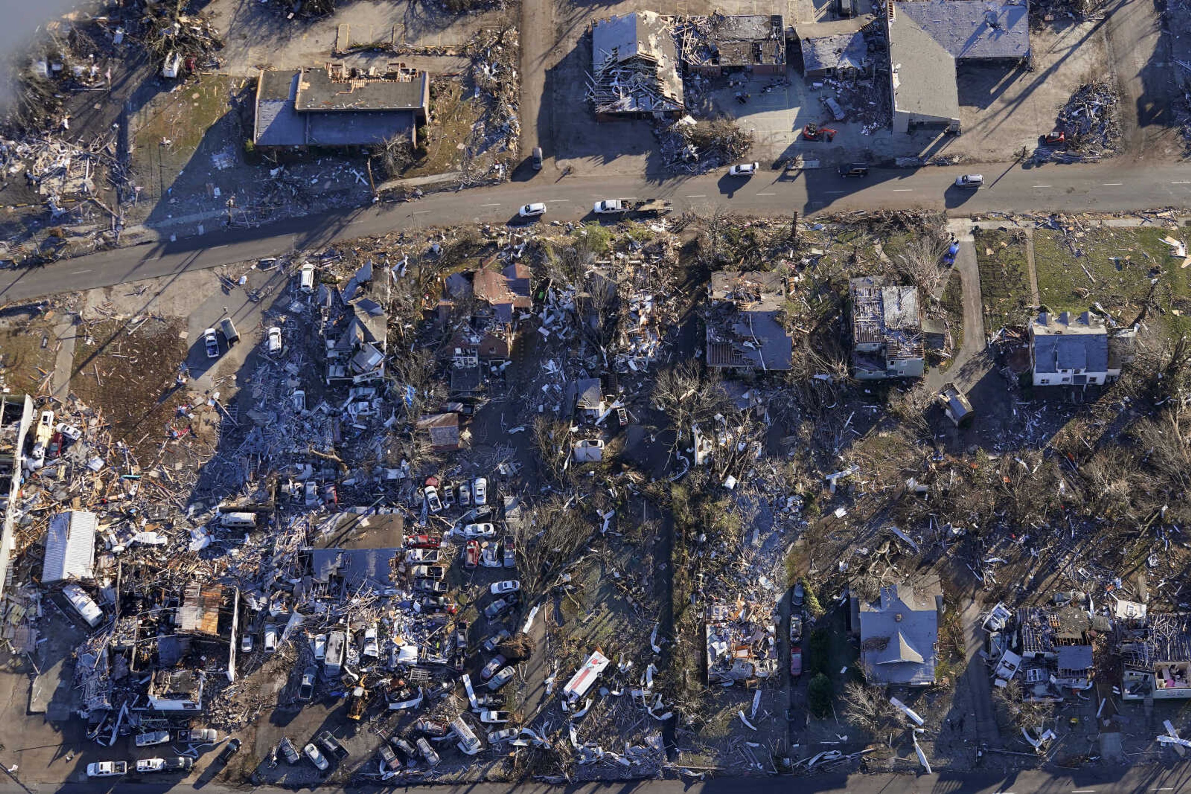 In this aerial photo, destruction from a recent tornado is seen in downtown Mayfield, Ky., Sunday, Dec. 12, 2021. (AP Photo/Gerald Herbert)