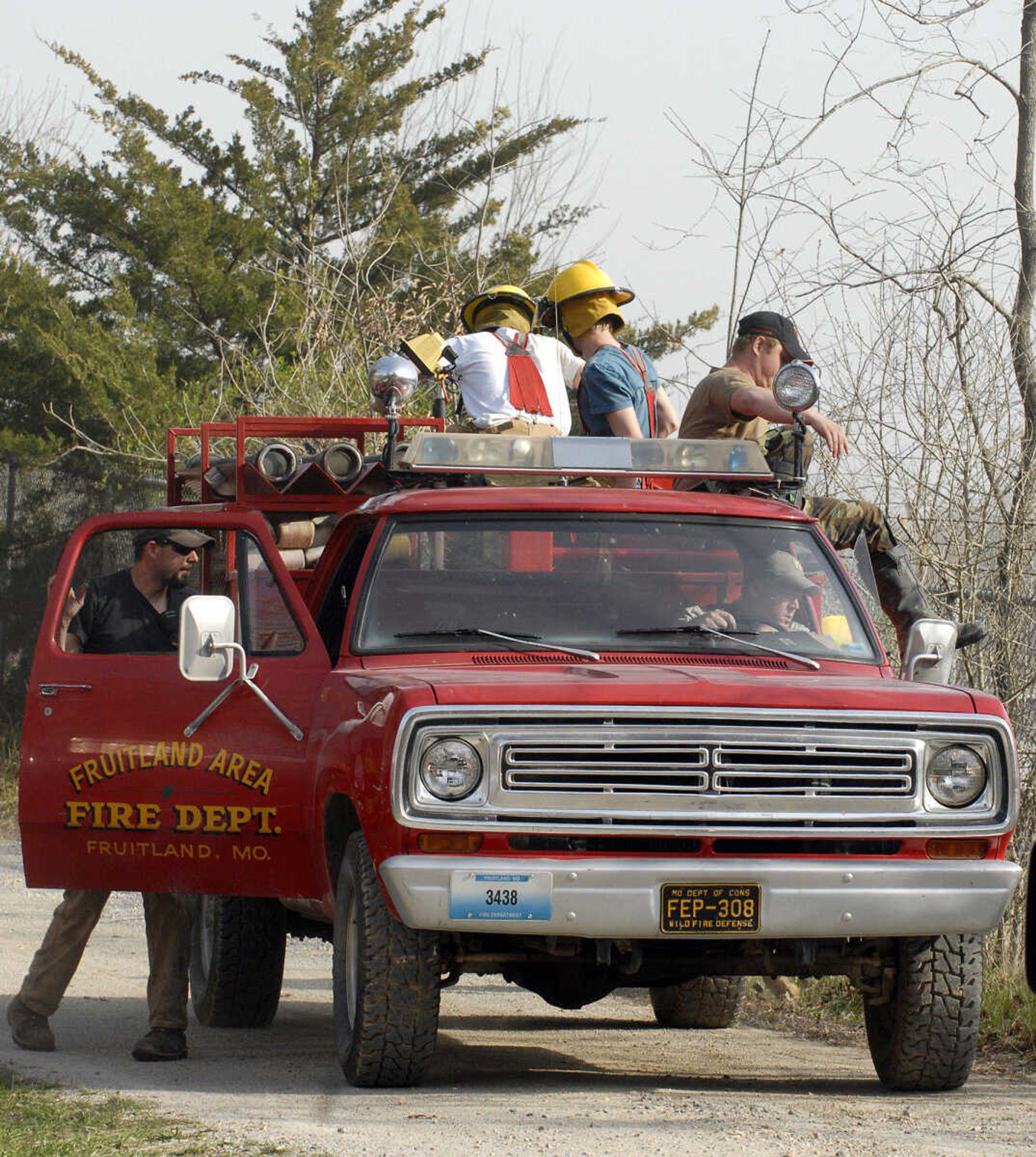 LAURA SIMON~lsimon@semissourian.com
Fruitland area firefighters arrive to the scene of a natural cover fire off of Cissus Lane near Neelys Landing Sunday, April 3, 2011. Firefighters from Cape Girardeau, Perry, Scott, and Bollinger Counties contained the blaze that ravaged 50 acres of land.