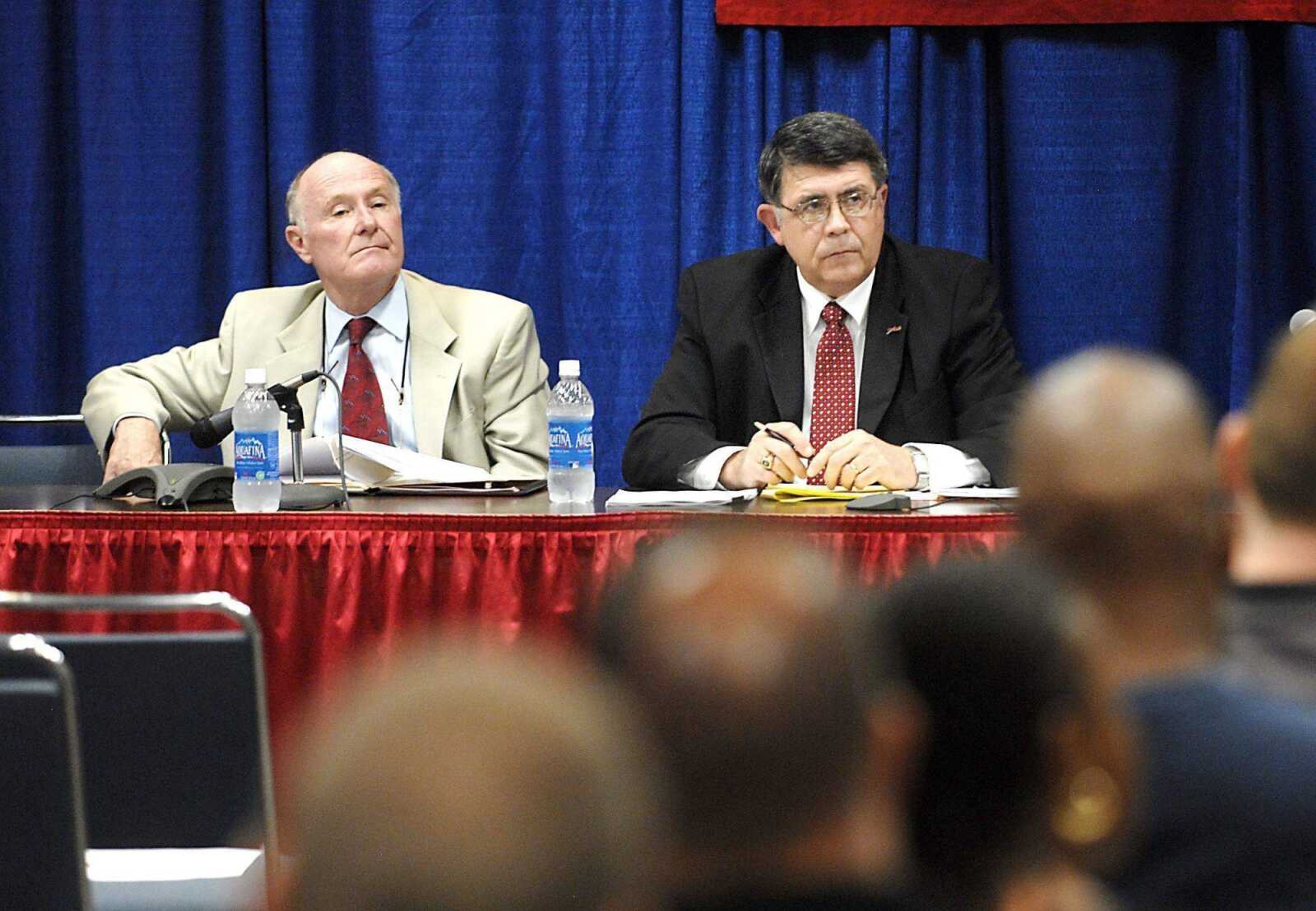 Southeast Missouri State athletic director John Shafer and school president Ken Dobbins listen to a teleconference with the NCAA Committee on Infractions Aug. 13 at the Show Me Center. Both the male and female basketball programs were found in violation of NCAA codes. (Southeast Missourian file)