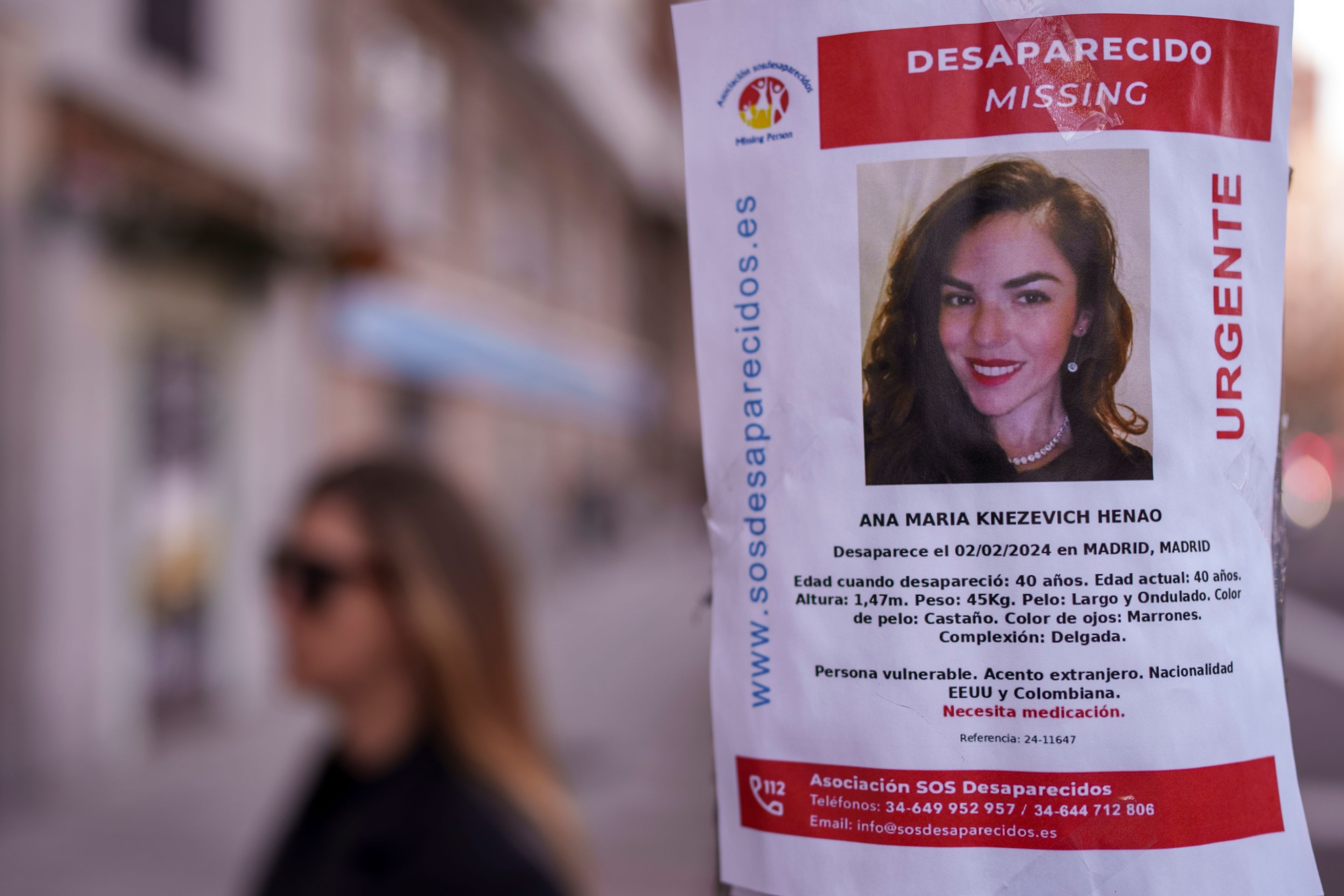 FILE - A missing poster for Colombian-born, American Ana Maria Knezevich Henao is displayed on a streetlight in Madrid, Spain, on Feb. 16, 2024. (AP Photo/Manu Fernandez, File)