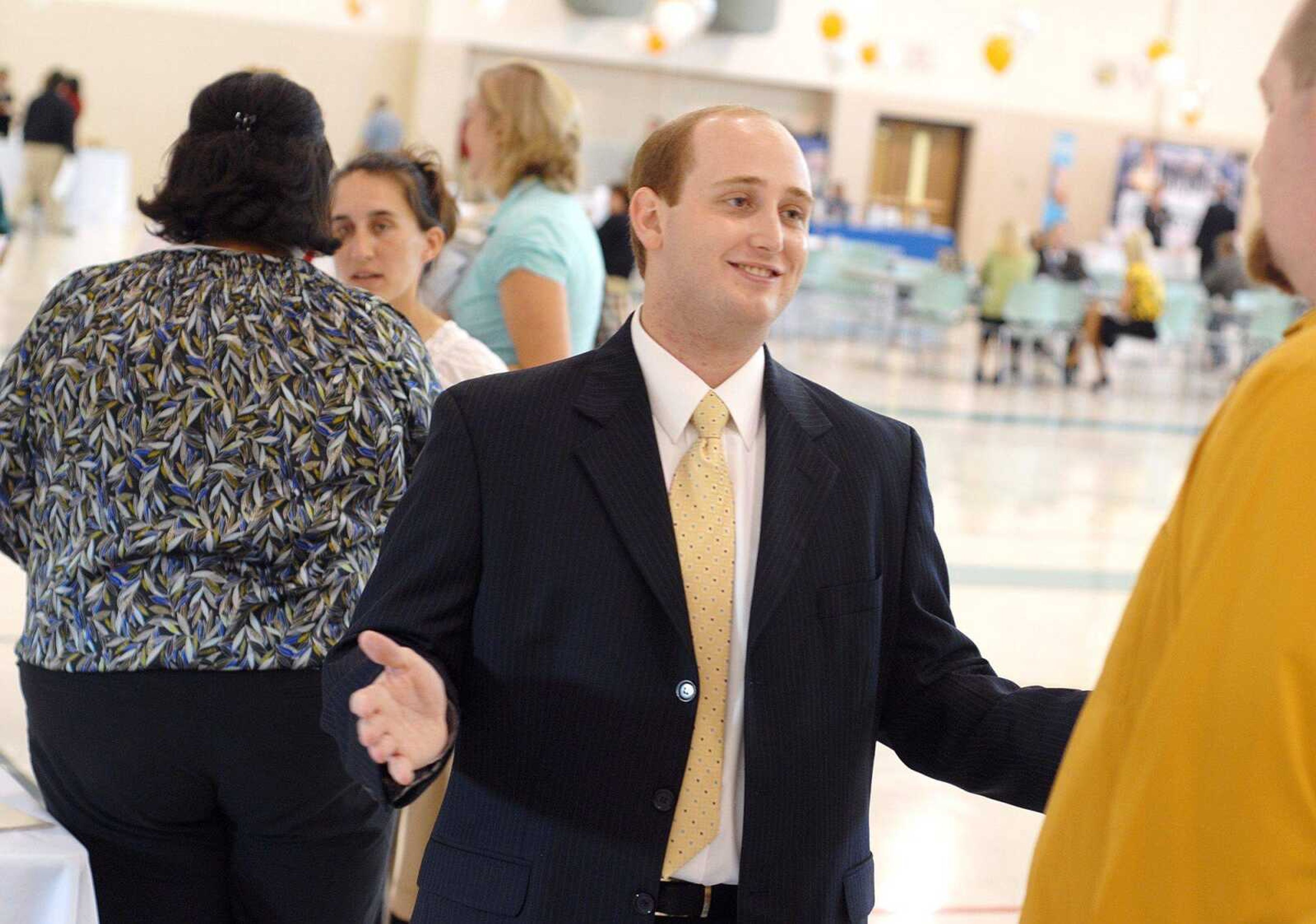 AARON EISENHAUER ~ aeisenhauer@semissourian.com
Jacob Daniel, a representative from Anderson Broadcasting, speaks with Chris Moser, who came to the career fair hoping to find a job that pays better than his current position on Tuesday, October 21, 2008.