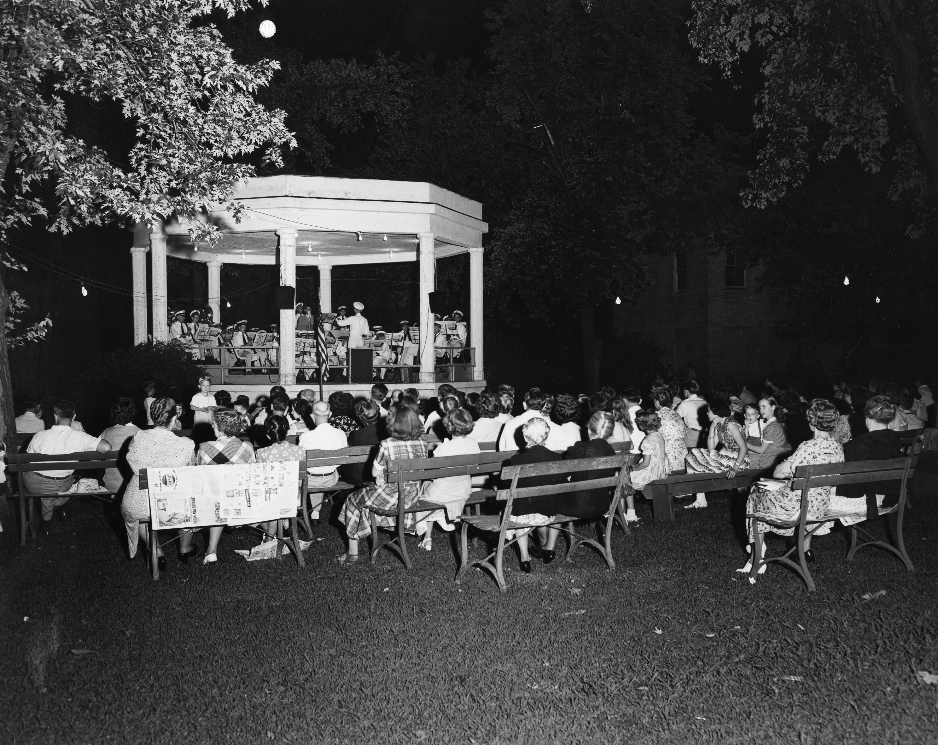 The Cape Girardeau Municipal Band place an evening concert at Courthouse Park in this undated image.