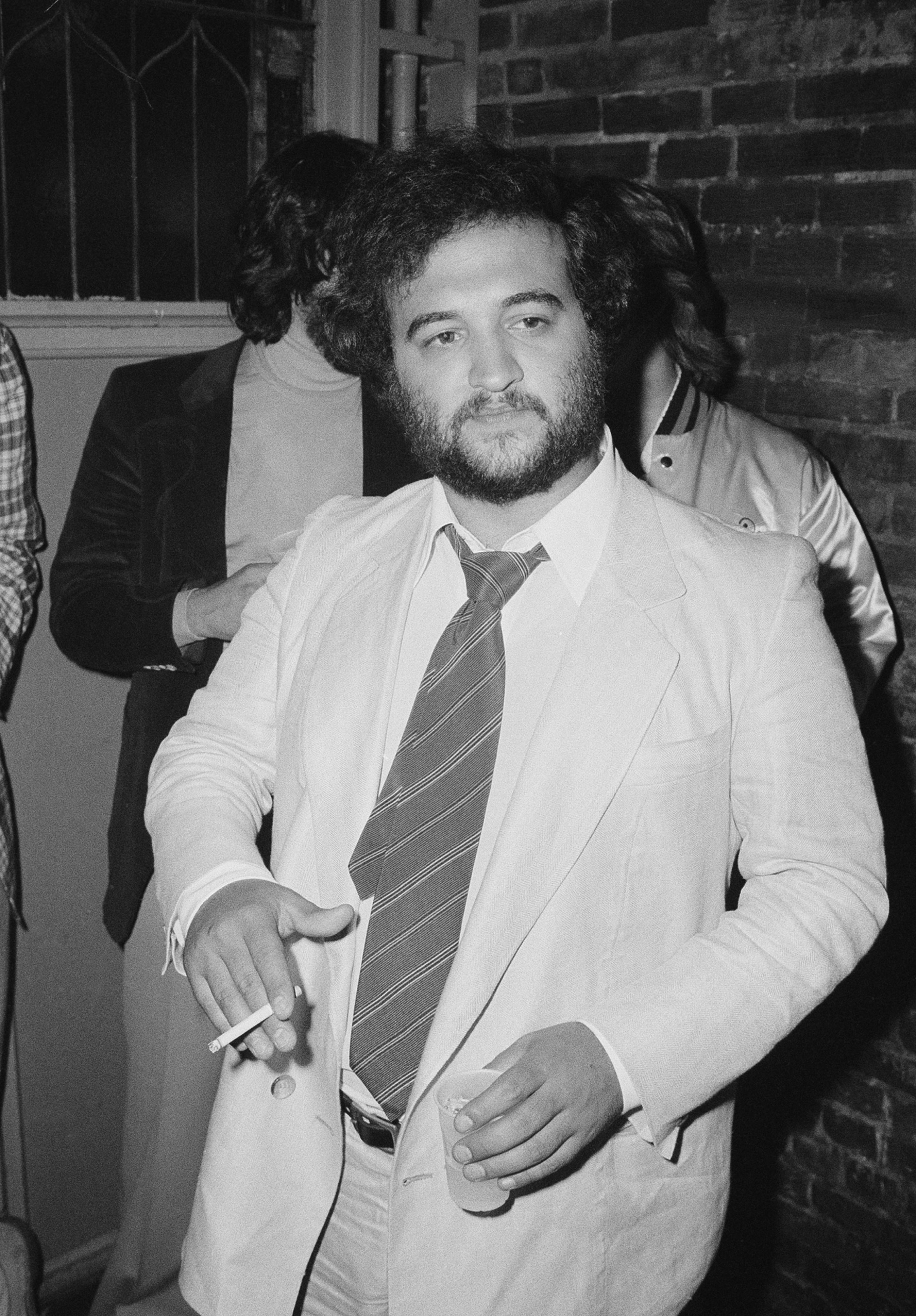 FILE - Actor John Belushi appears at the opening night party for "Animal House" at the Village Gate in New York on July 27, 1978. Belushi died March 5, 1982, at 33 after overdosing at the Chateau Marmont in Los Angeles. (AP Photo, File)