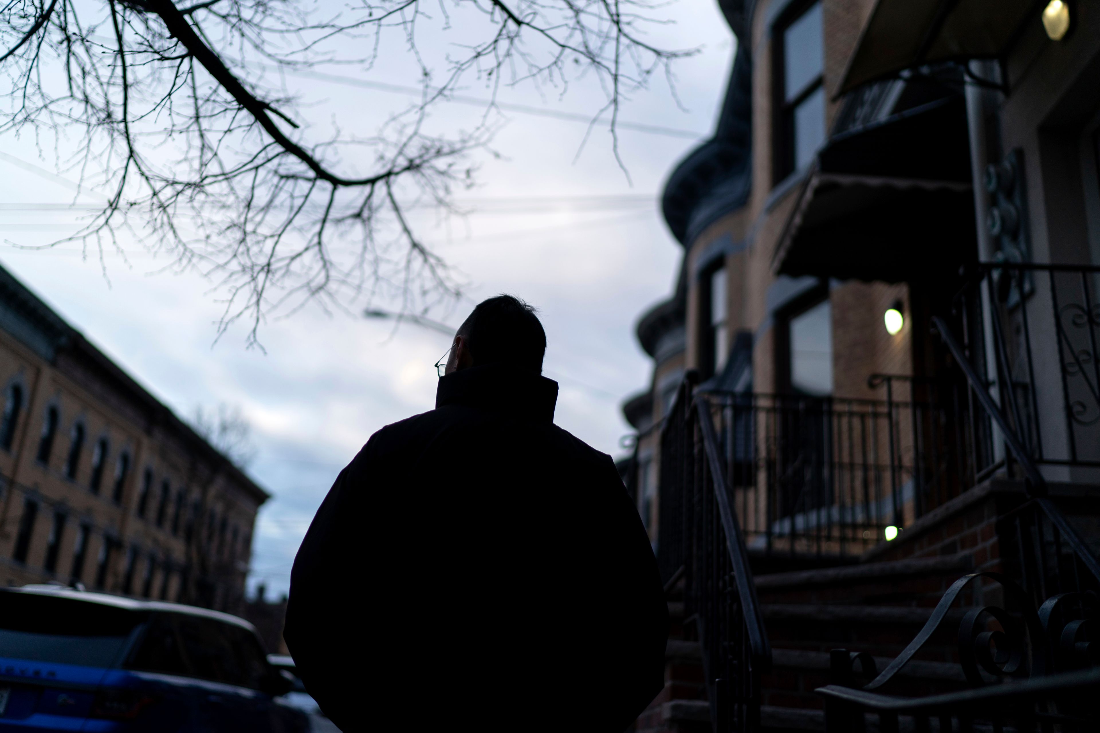 Robert Calabretta, who was adopted as a baby out of South Korea to an American family, walks through his neighborhood, Thursday, Feb. 15, 2024, in New York. (AP Photo/David Goldman)