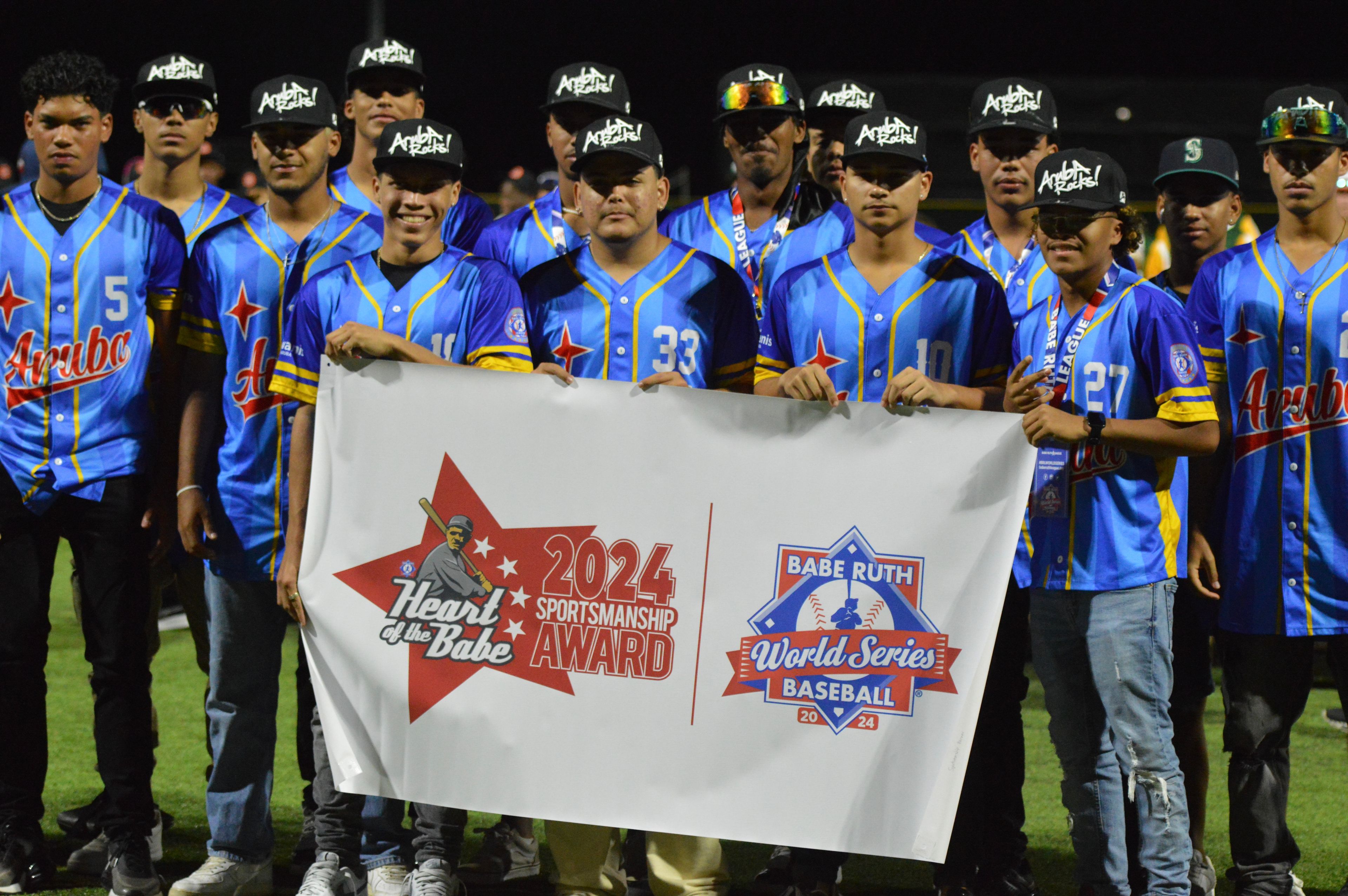 Team Aruba holds the sportsmanship team award banner at the Babe Ruth World Series on Thursday, Aug. 15, at Capaha Field in Cape Girardeau, Mo. 