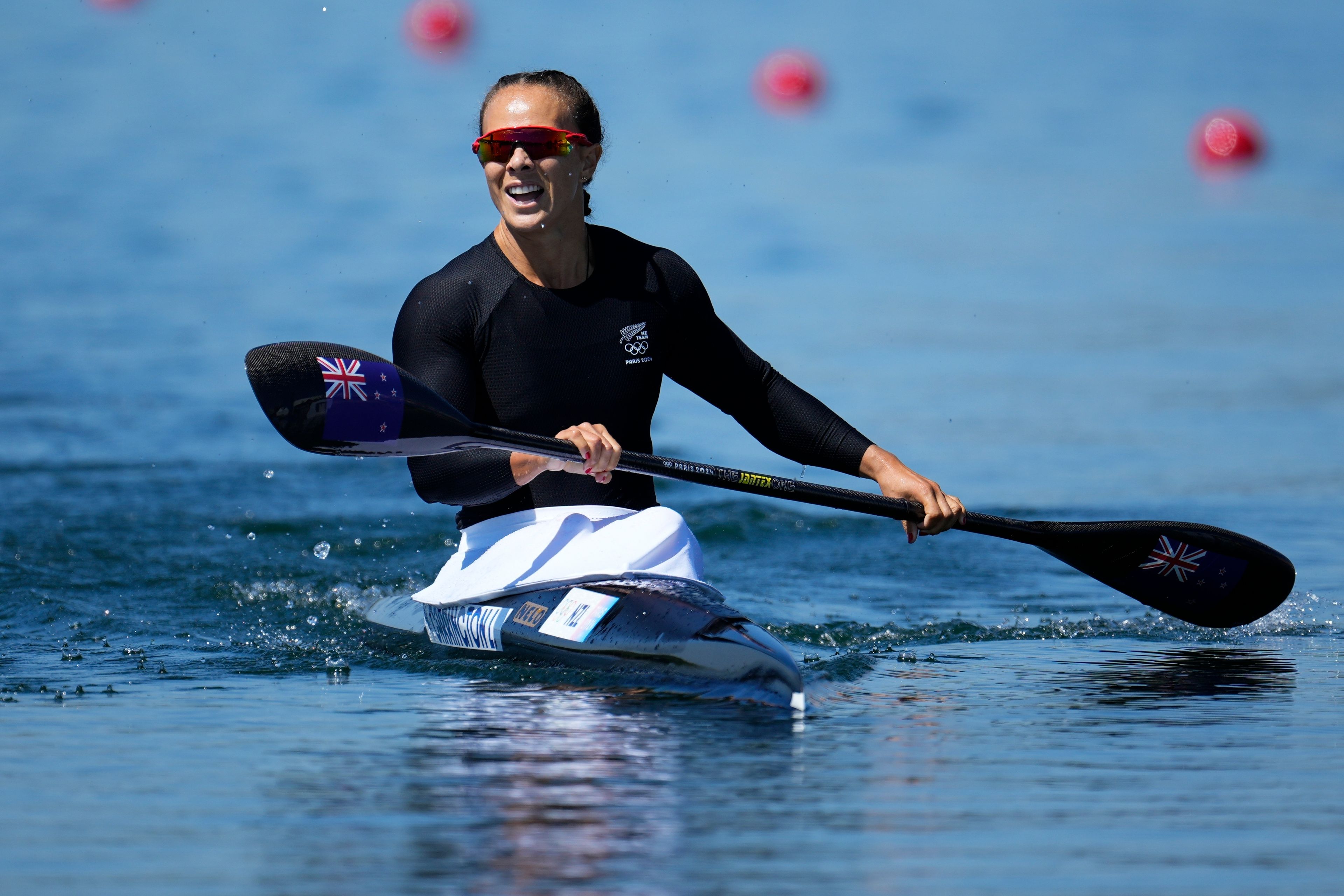 Lisa Carrington, of New Zealand, reacts after winning gold in the women's kayak single 500-meter finals at the 2024 Summer Olympics, Saturday, Aug. 10, 2024, in Vaires-sur-Marne, France. (AP Photo/Ebrahim Noroozi)