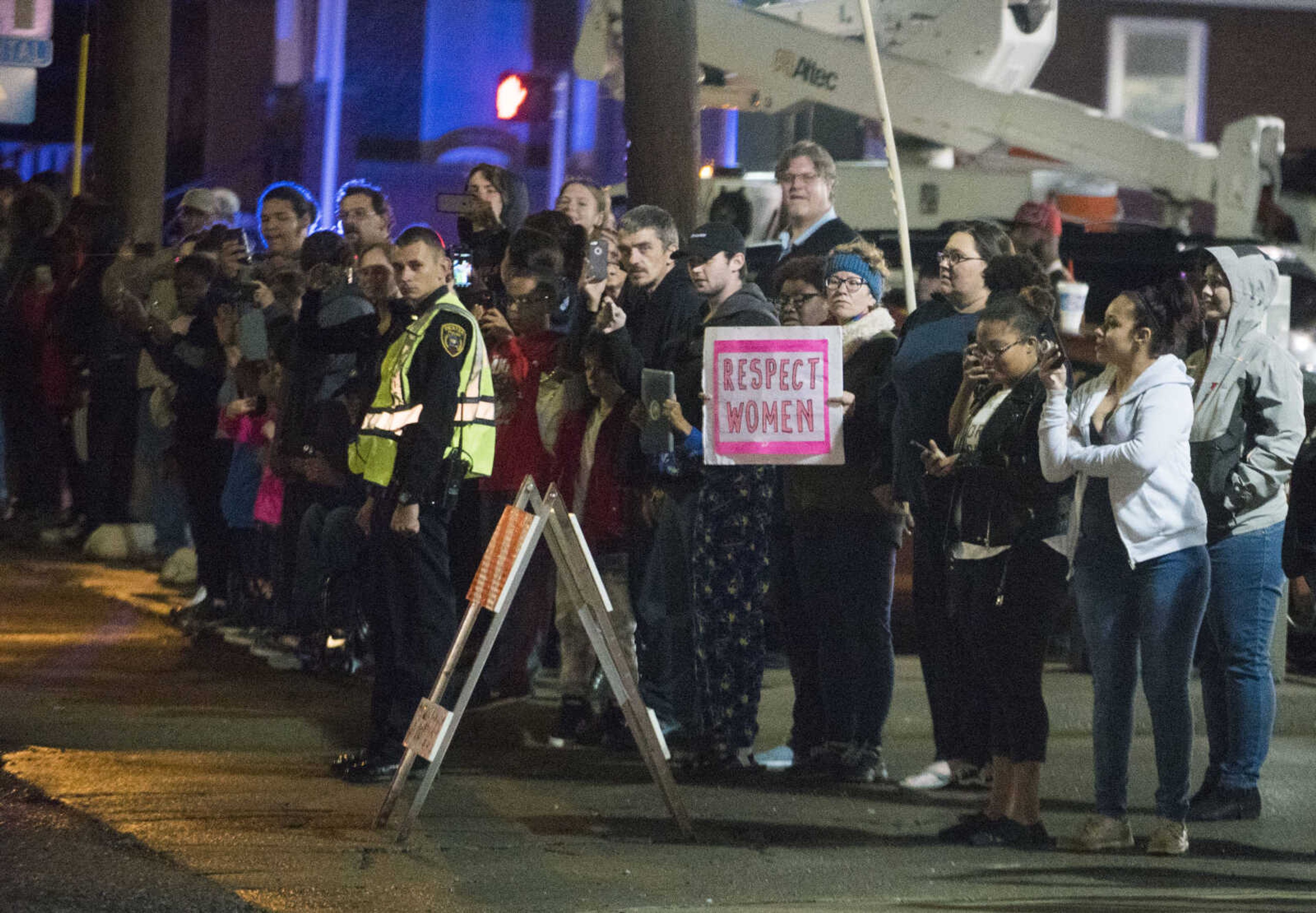 Pedestrians stand at the intersection of West End and Independence as the presidential motorcade travels to the Show Me Center for a Make America Great Again rally Monday, Nov. 5, 2018, in Cape Girardeau.