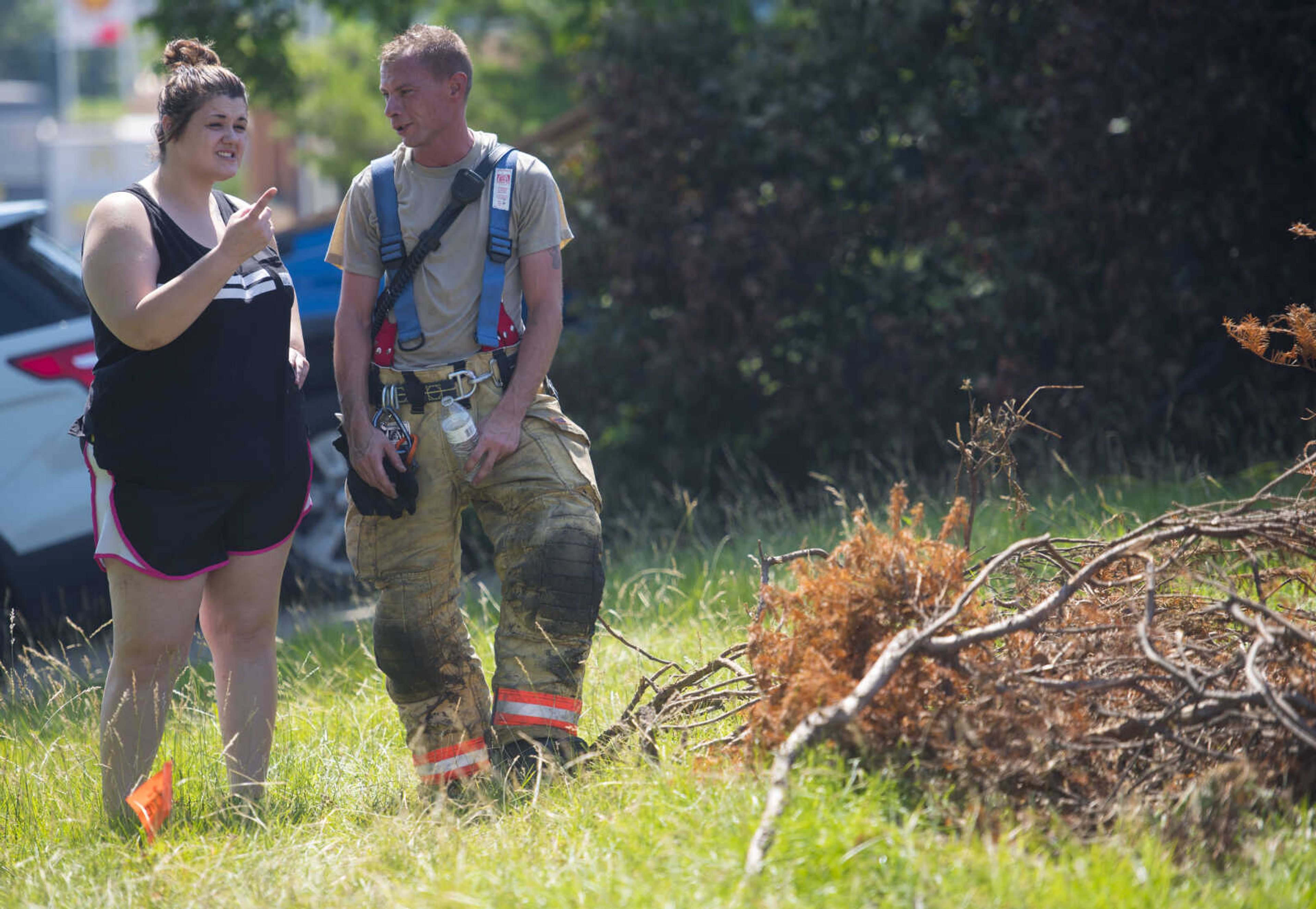 Casaundra Hastings talks to her boyfriend, Gordonville firefighter Robbie Stagner, during live-fire training June 10, 2017 in Cape Girardeau.