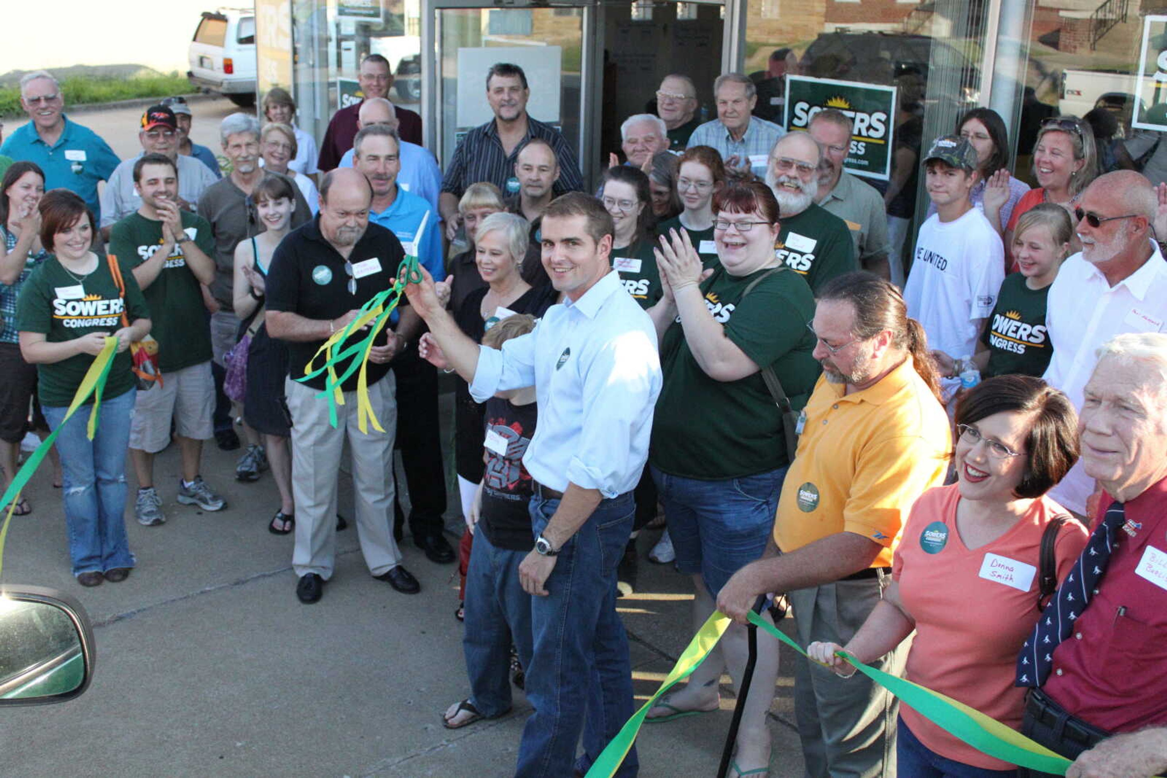 Tommy Sowers and supporters cut ribbon to celebrate opening of Cape Girardeau office.