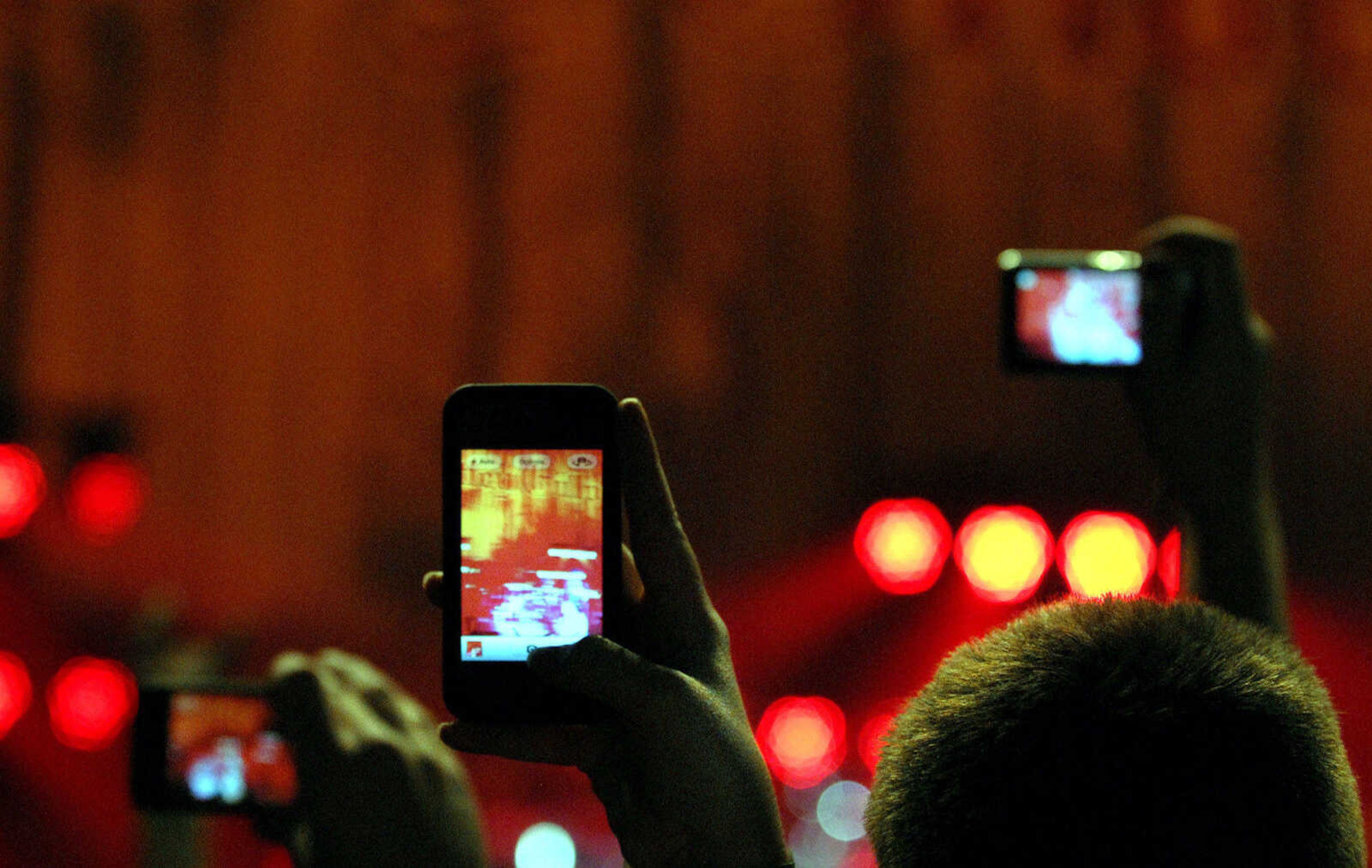 LAURA SIMON ~ lsimon@semissourian.com
Fans record a performance by Brantley Gilbert on their cell phones Friday night, January 20, 2012 during the "Blood, Sweat and Beers Tour" at the Show Me Center in Cape Girardeau.