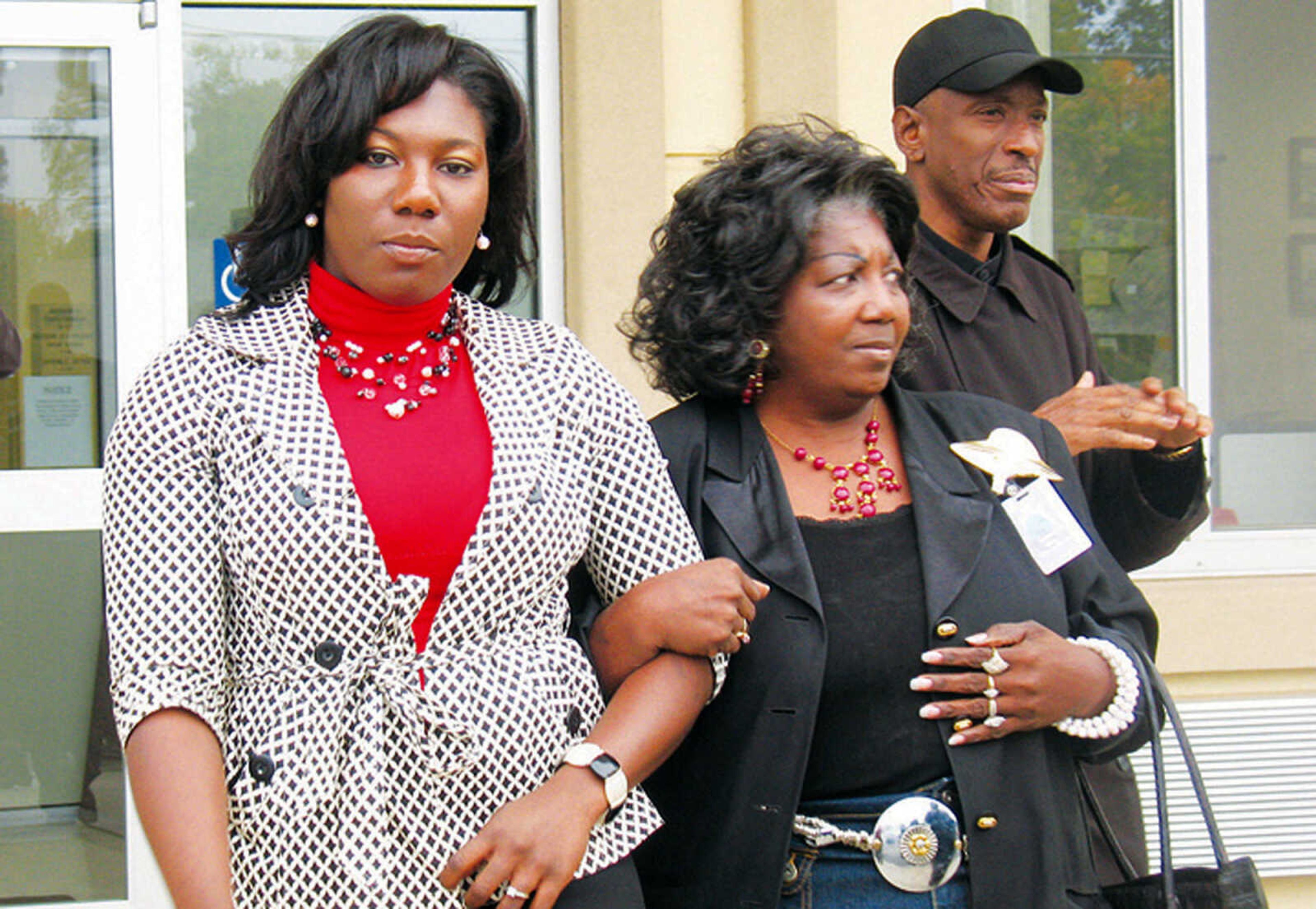 FILE - This Nov. 4, 2009 file photo shows Heather Ellis, left, arm-in-arm with her mother, Hester Ellis, exiting the Stoddard County Justice Center in Bloomfield, Mo. Testimony in the trial of Ellis, a black school teacher charged with assaulting police officers, resisting arrest and disturbing the peace at a Missouri store, concluded Friday with the defendant telling the jury that white police officers had attacked and abused her. (AP Photo/Corey Noles, Dexter Daily Statesman, File)