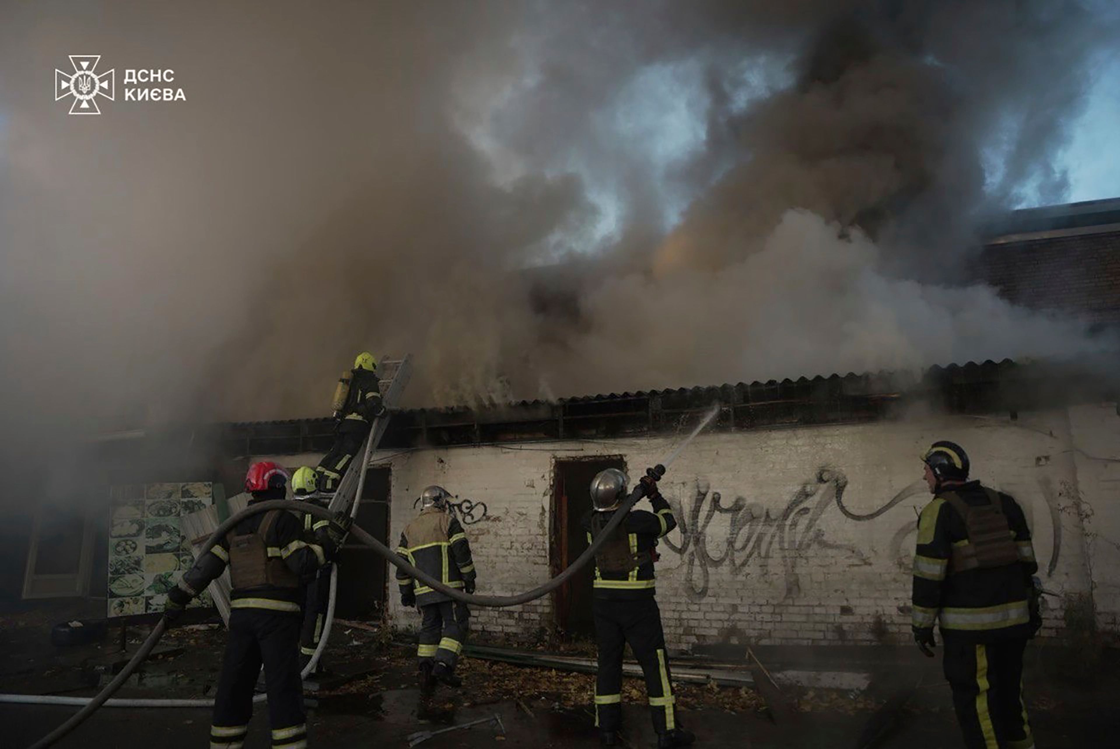 In this photo provided by the Ukrainian Emergency Service on Thursday, Nov. 7, 2024, rescuers put out a fire resulted from Russian drone attack in Kyiv, Ukraine. (Ukrainian Emergency Service via AP)