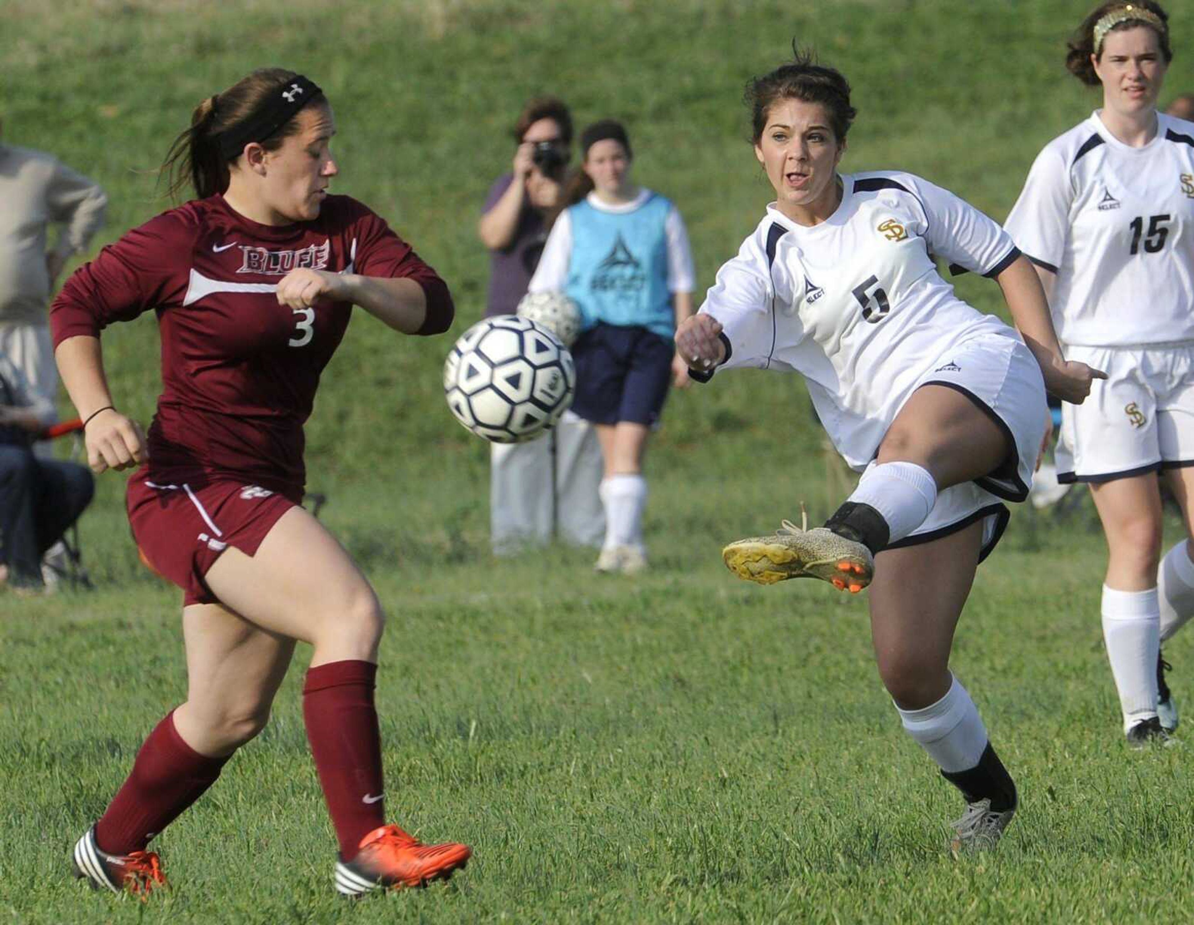 Saxony Lutheran&#8217;s Maci Daniel kicks the ball past Poplar Bluff&#8217;s Maria Zavela to score the Crusaders&#8217; second goal during the first half Tuesday at Saxony Lutheran High School. (Fred Lynch)