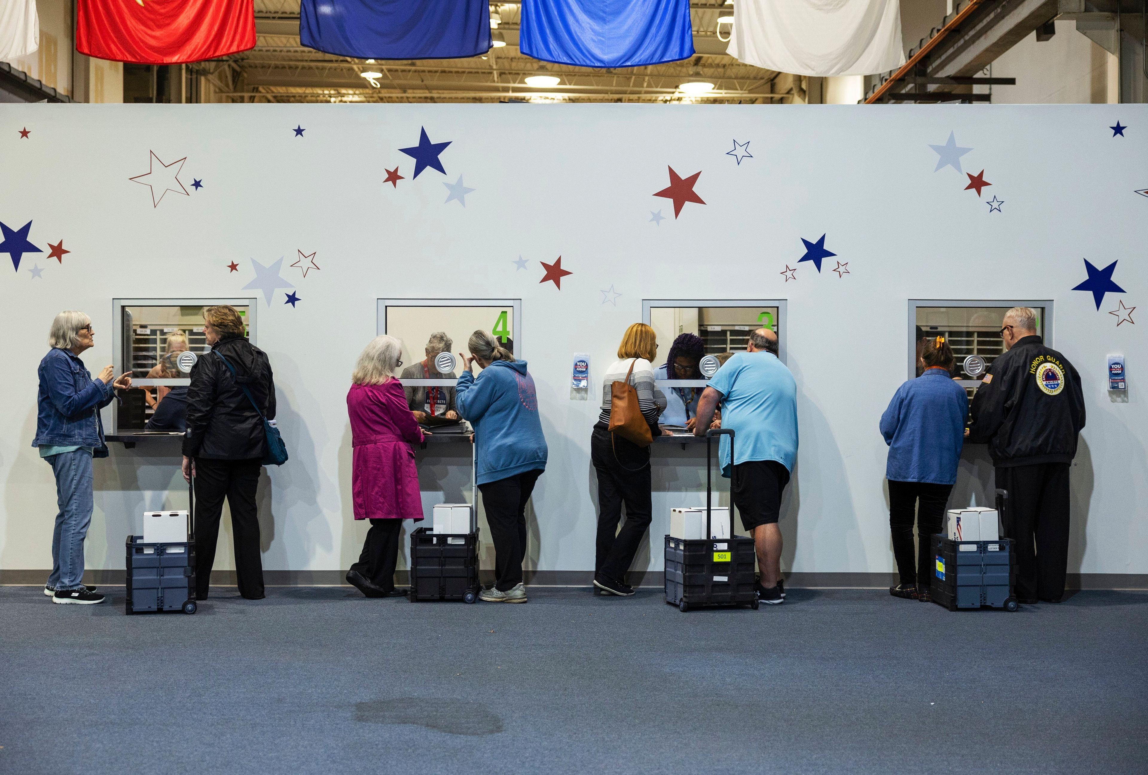 Election officials check in ballots that were cast in-person on Election Day on Tuesday, Nov. 5, 2024, at St. Charles County Election Authority in St. Charles, MO. ( Zachary Linhares/St. Louis Post-Dispatch via AP)