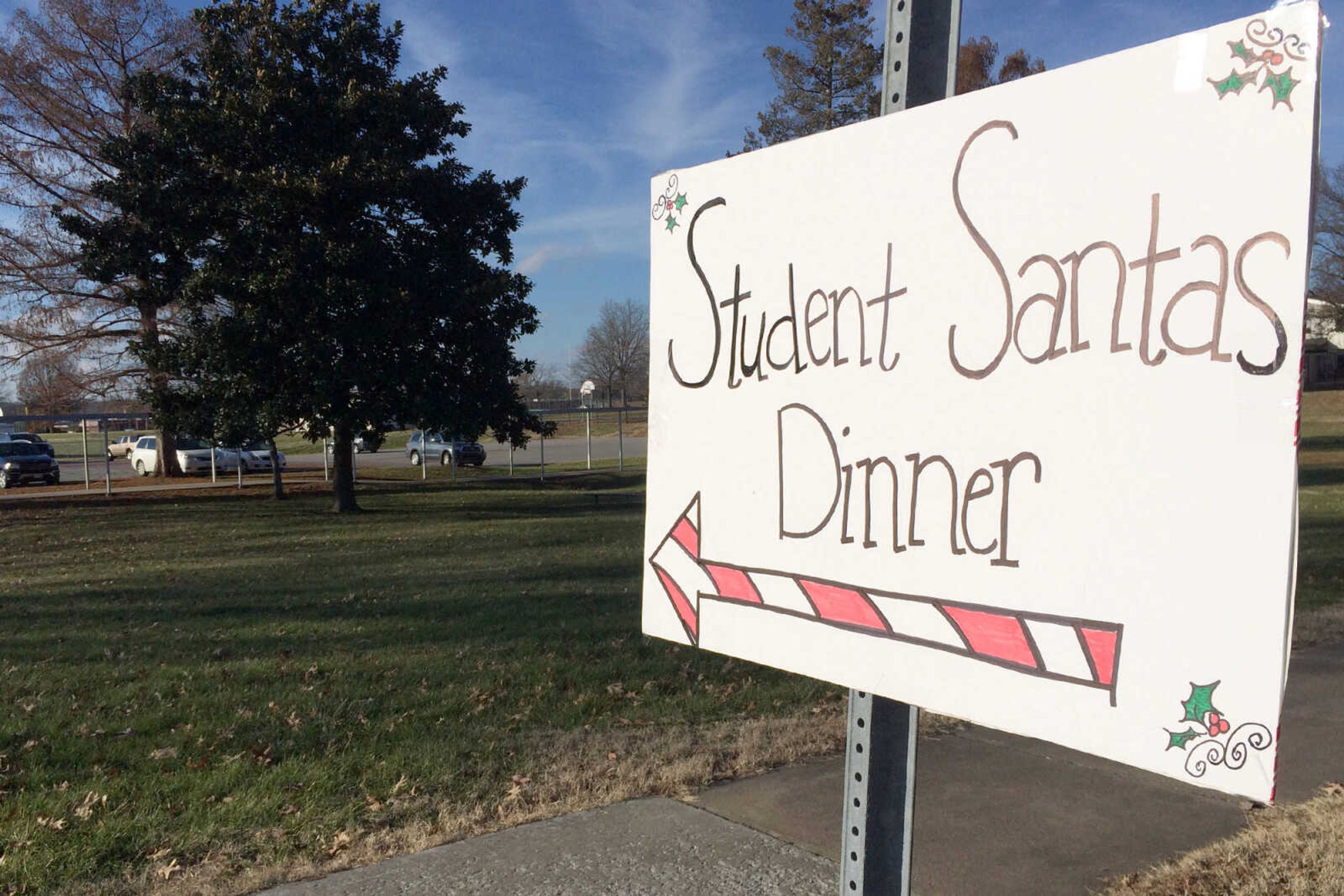 GLENN LANDBERG ~ glandberg@semissourian.com

A sign on Caruthers Ave. directs people to the Student Santas Christmas dinner for families in need Thursday, Dec. 25, 2014 at Central Junior High School.