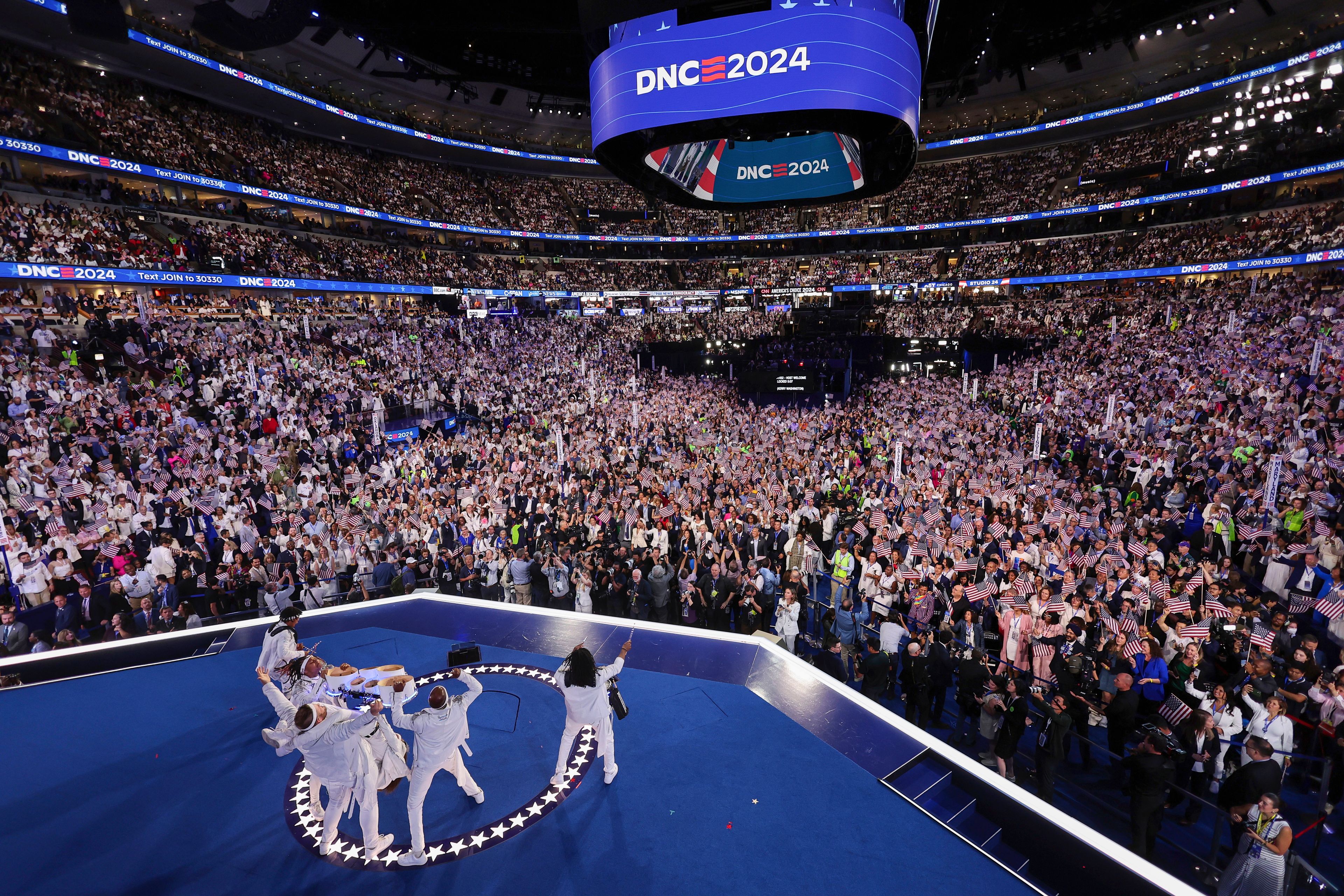 The Pack Drum Line, the official drum line of the Chicago Sky and the Chicago Bulls, perform during the final day of the Democratic National Convention in Chicago, Thursday, Aug. 22, 2024. (Mike Segar/Pool via AP)