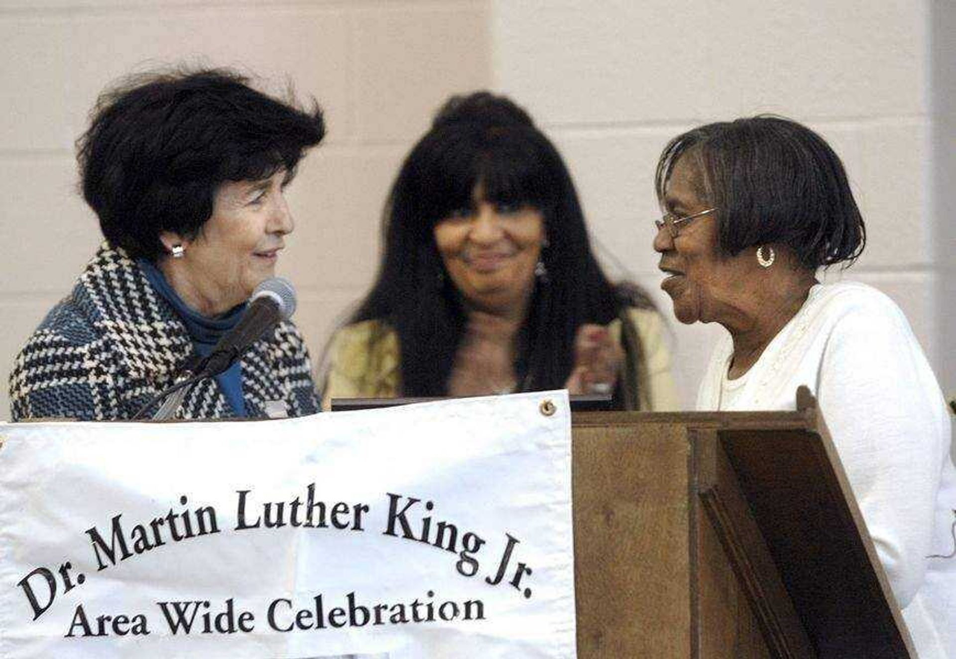 FRED LYNCH ~ flynch@semissourian.comMarcia Ritter, left, presents a C. John Ritter Humanitarian Award to Beulah Vann Perry at the Dr. Martin Luther King Jr. Humanitarian Luncheon Monday at the Osage Community Centre, as Debra Mitchell-Braxton watches.