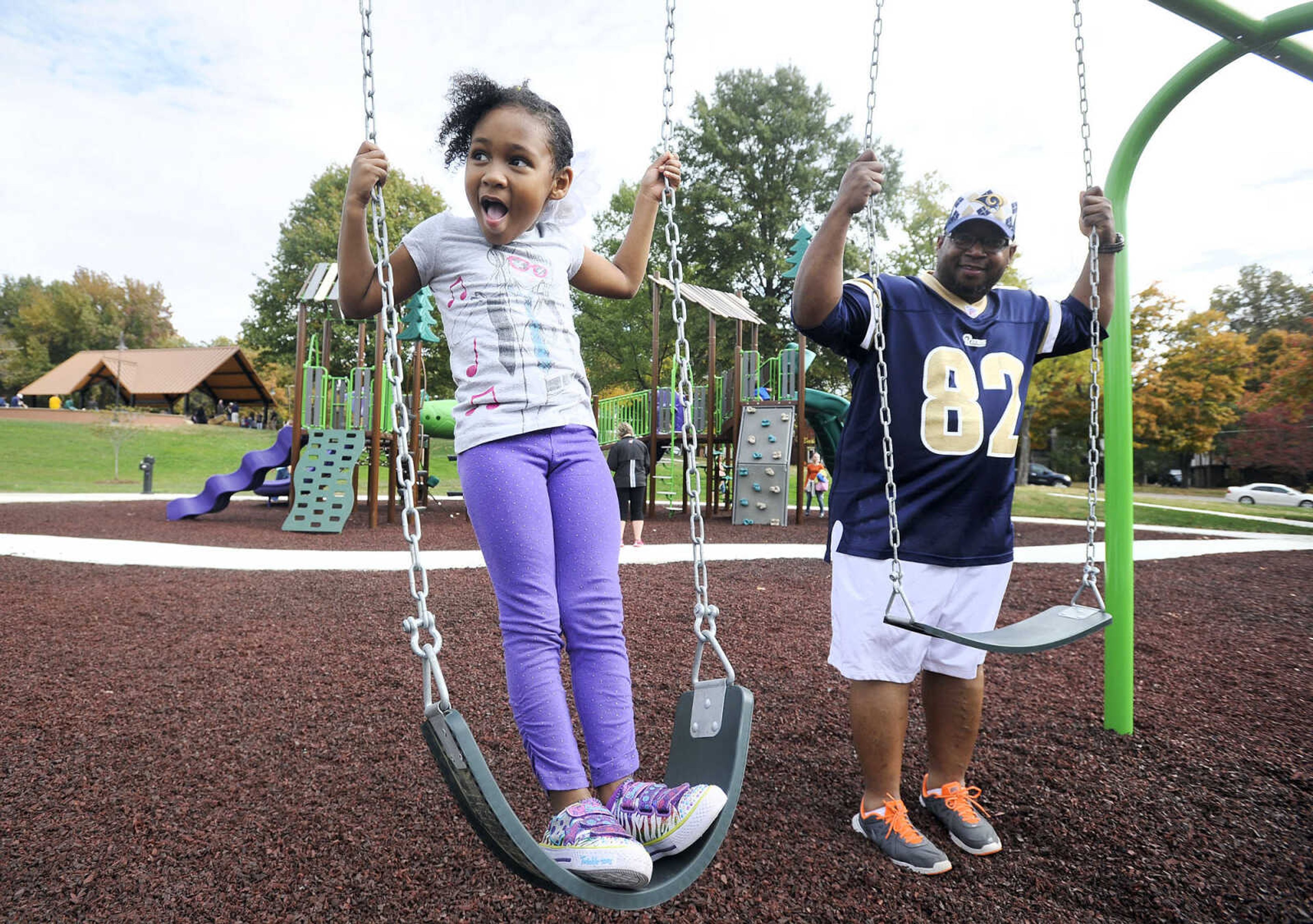 LAURA SIMON ~ lsimon@semissourian.com

Amaiyah Edwards, left, plays on the swings with her grandfather, Ken Whitehorn, at the new playground in Capaha Park, Friday, Oct. 23, 2015, in Cape Girardeau.