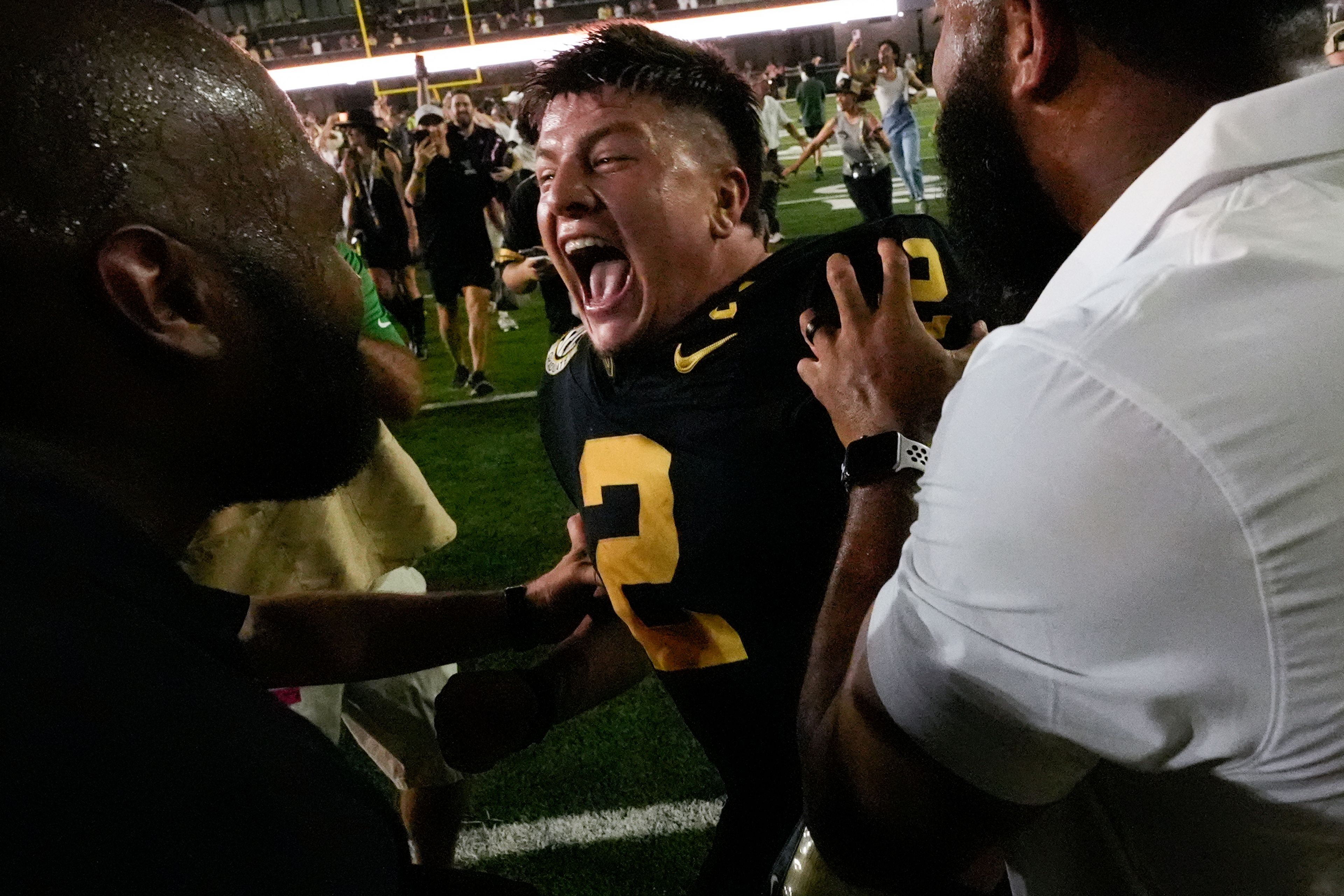 Vanderbilt quarterback Diego Pavia (2) celebrates the team's 40-35 win over No. 1 Alabama after an NCAA college football game Saturday, Oct. 5, 2024, in Nashville, Tenn. (AP Photo/George Walker IV)