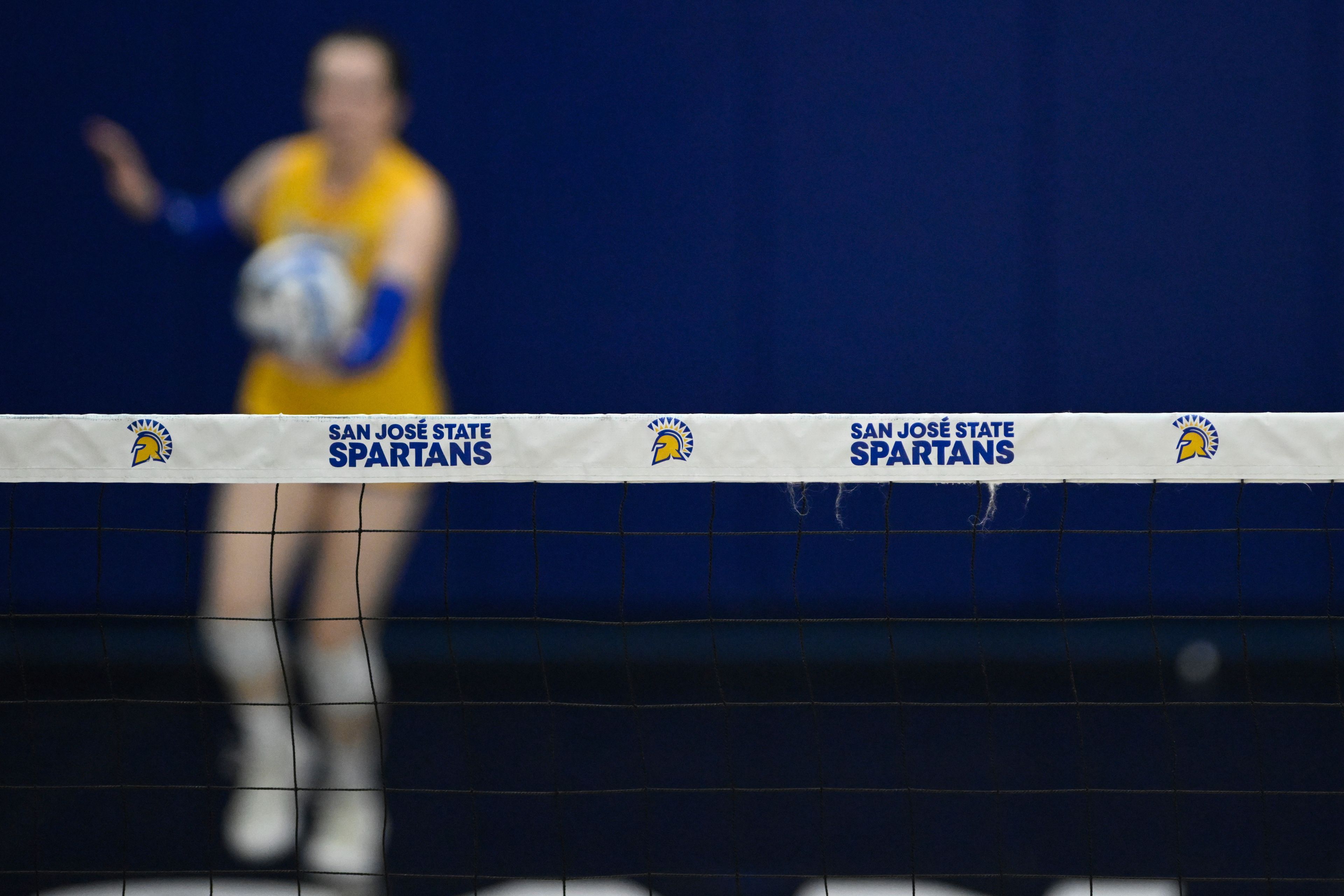 The San Jose State Spartans logo is seen on the net against the Air Force Falcons during the third set of an NCAA college volleyball match Thursday, Oct. 31, 2024, in San Jose, Calif. (AP Photo/Eakin Howard)