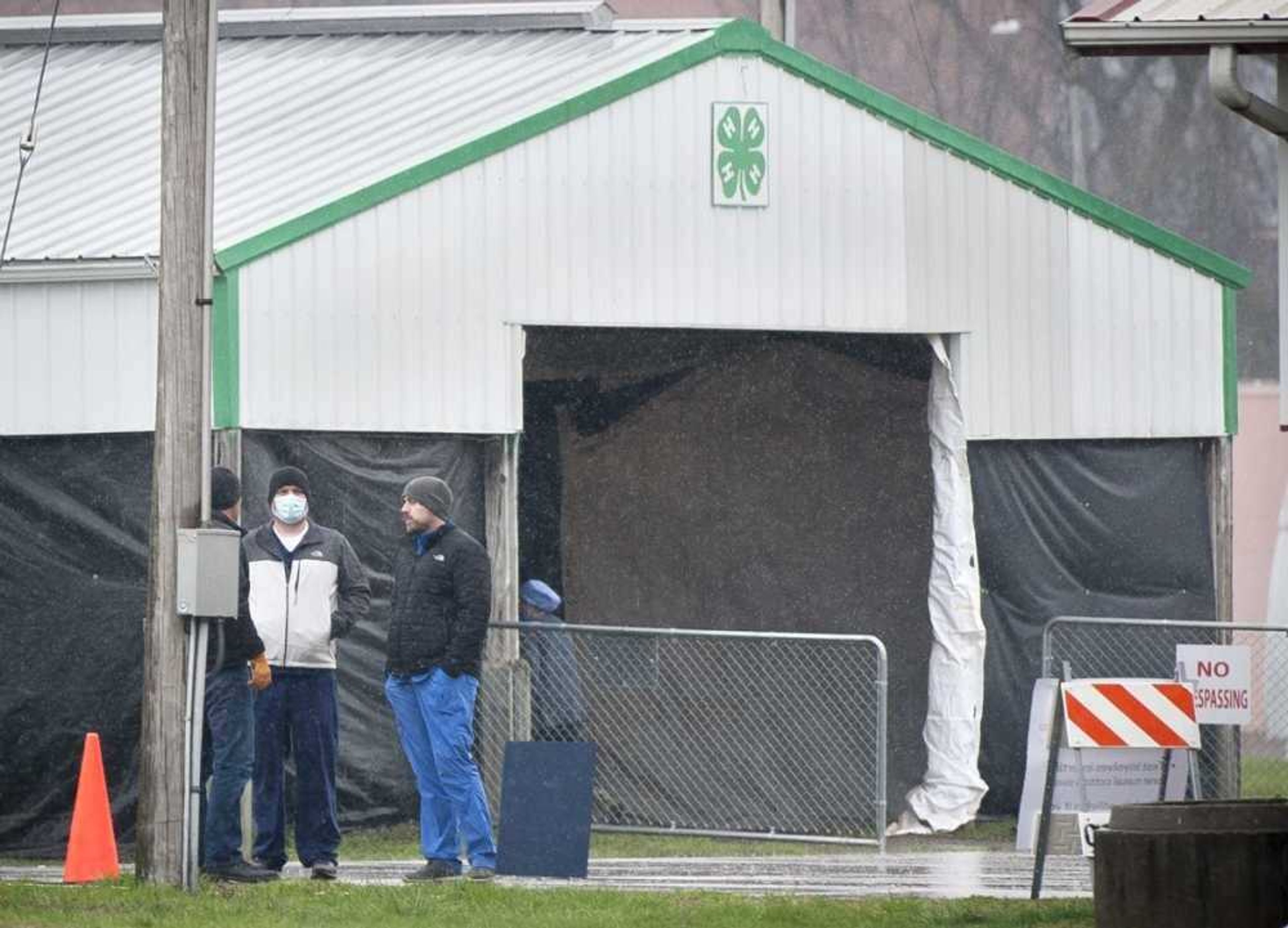 A group of workers is seen at the drive-through testing center in Arena Park as rain falls Tuesday in Cape Girardeau. The testing facility operates on an appointment-only basis, and is a combined effort among Saint Francis Healthcare System, SoutheastHEALTH and the Cape Girardeau County Health Department in response to the coronavirus. A prescreening process must be conducted before an appointment may be scheduled. Prescreening can be performed by calling the local coronavirus hotline at (573) 331-4200 between 7 a.m. and 5 p.m. daily.