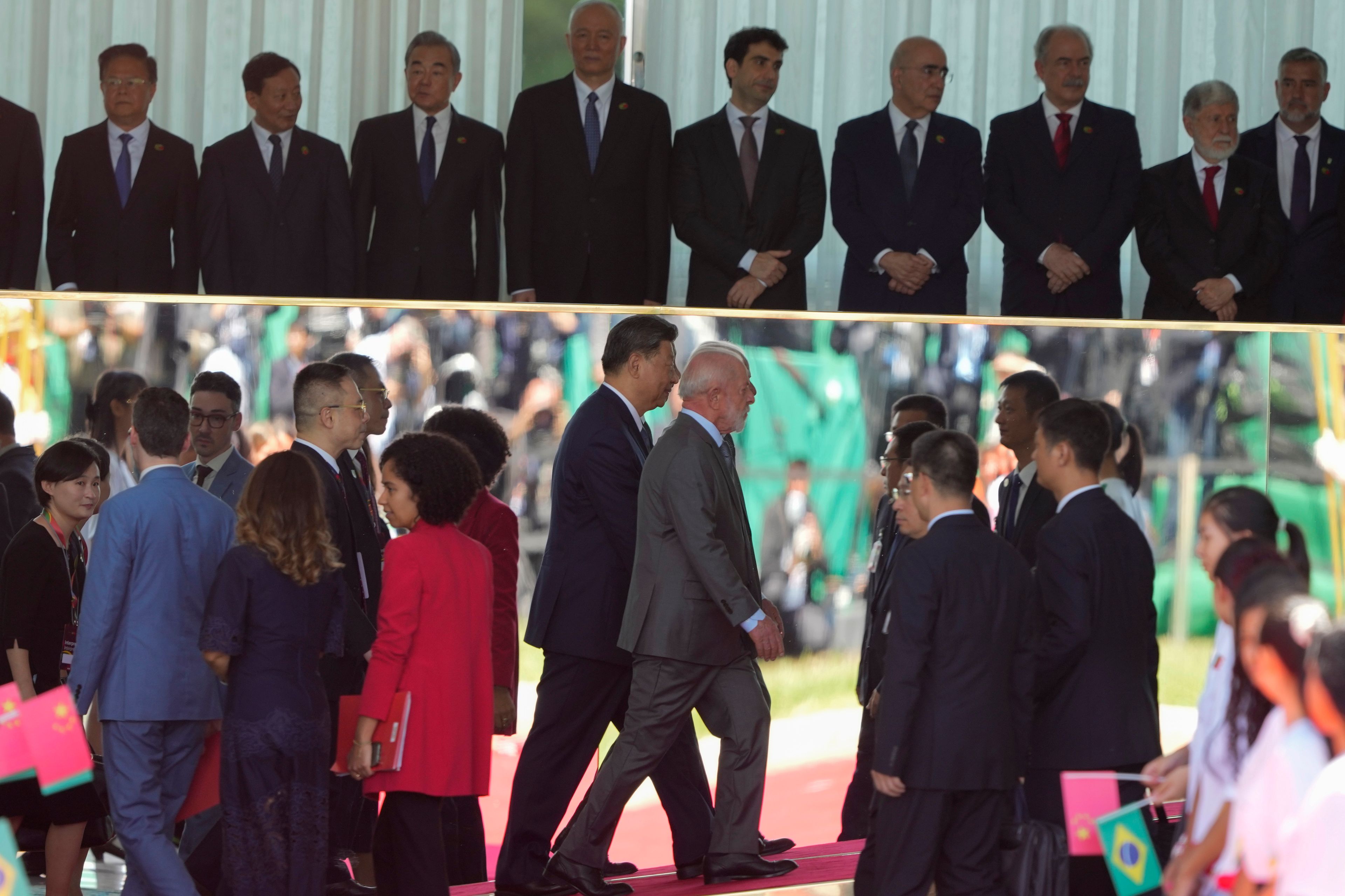 China's President Xi Jinping, left center, and Brazil's President Luiz Inacio Lula da Silva, walk into the Alvorada palace after attending a welcoming ceremony in Brasilia, Brazil, Nov. 20, 2024. (AP Photo/Eraldo Peres)