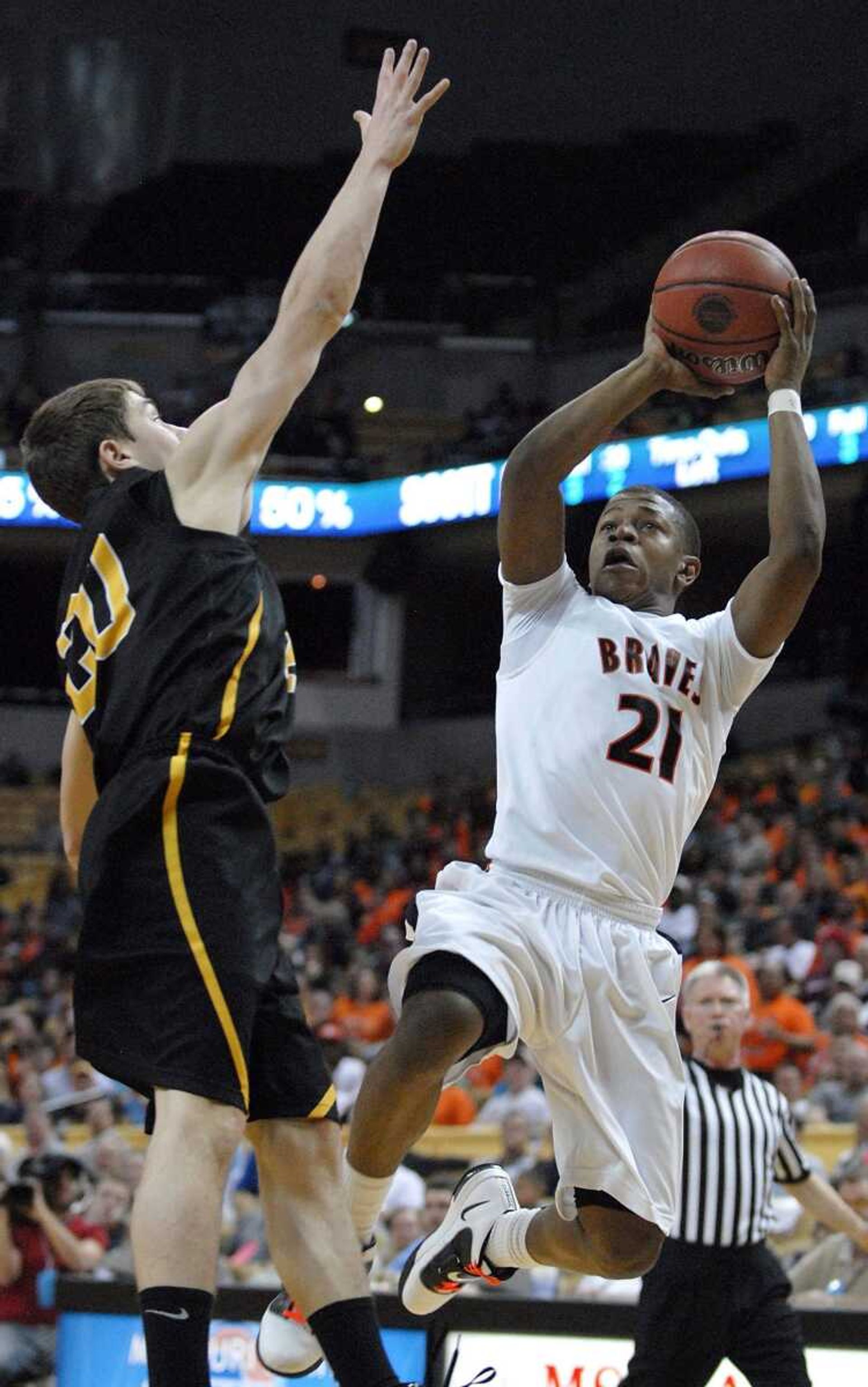 Scott County Central's Lamarcus Steward shoots over Dadeville's Zach Medley during the second quarter of the Class 1 championship game Saturday in Columbia, Mo.