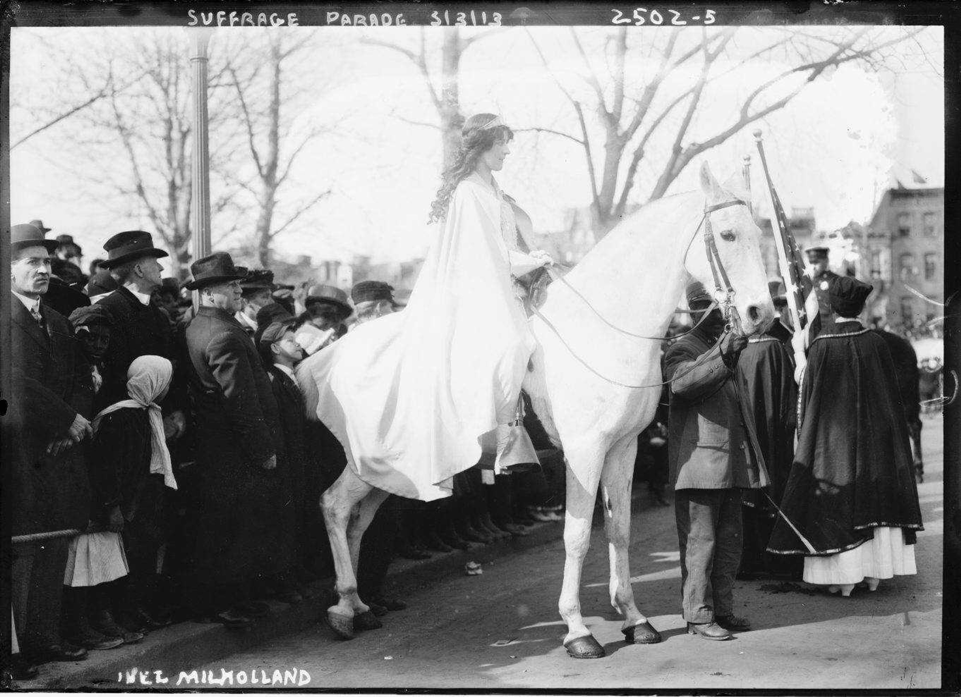 Attorney Inez Milholland Boissevain rides astride during the 1913 suffrage parade in Washington as the first of four mounted heralds.