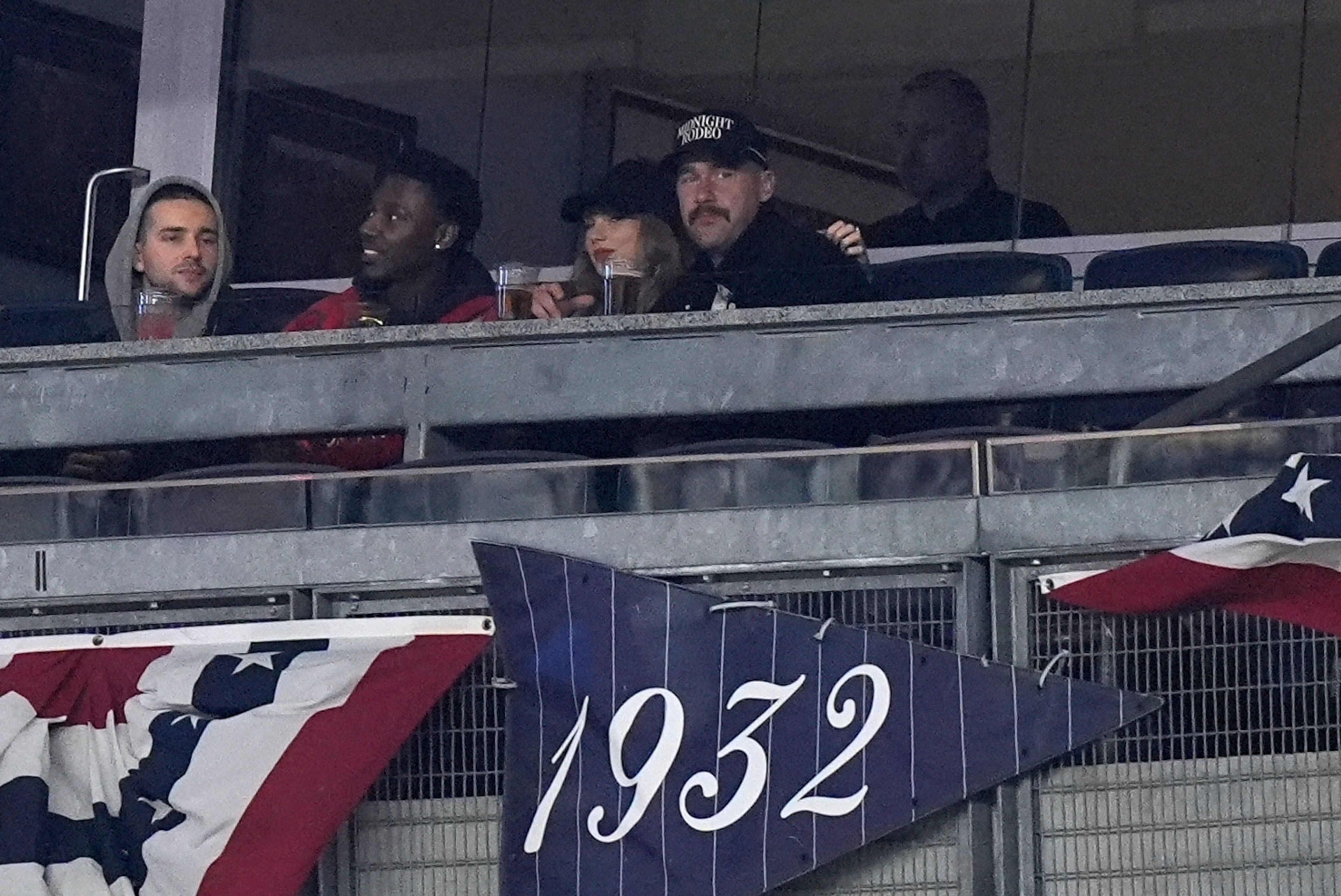 Travis Kelce and Taylor Swift watch Game 1 of the baseball AL Championship Series between the Cleveland Guardians and New York Yankees Monday, Oct. 14, 2024, in New York. (AP Photo/Frank Franklin II)