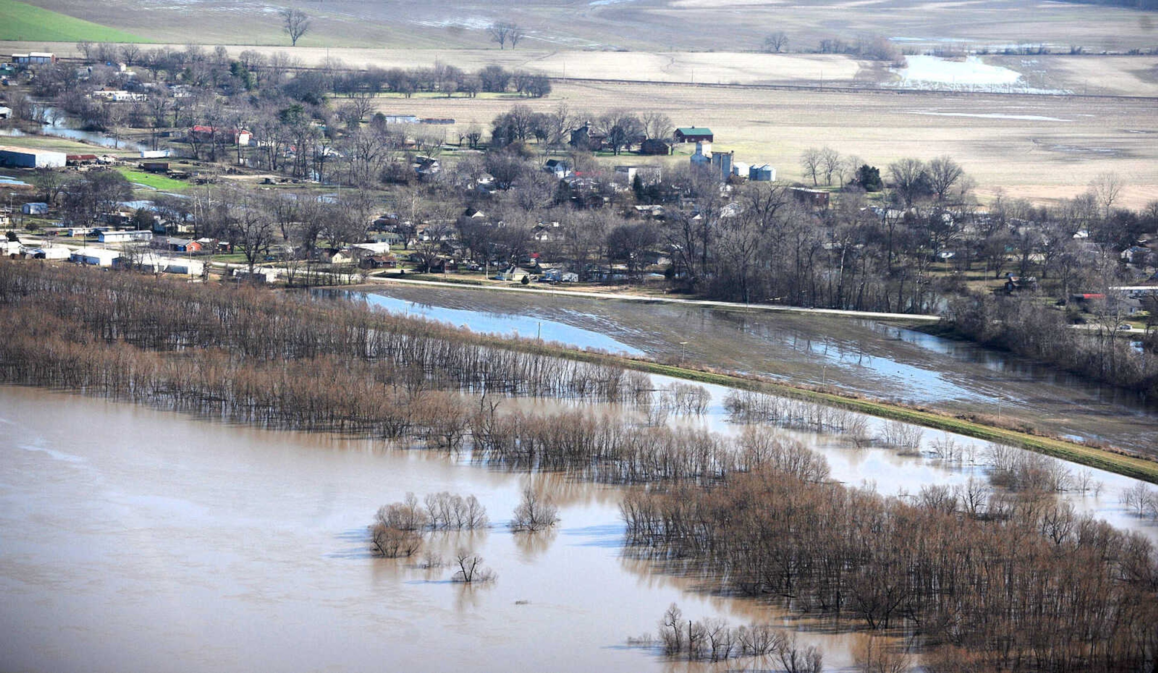 LAURA SIMON ~ lsimon@semissourian.com

Water seeps into portions of McClure, Illinois as the swollen Mississippi River pushes against the levee protecting the Southern Illinois town, Saturday, Jan. 2, 2016.