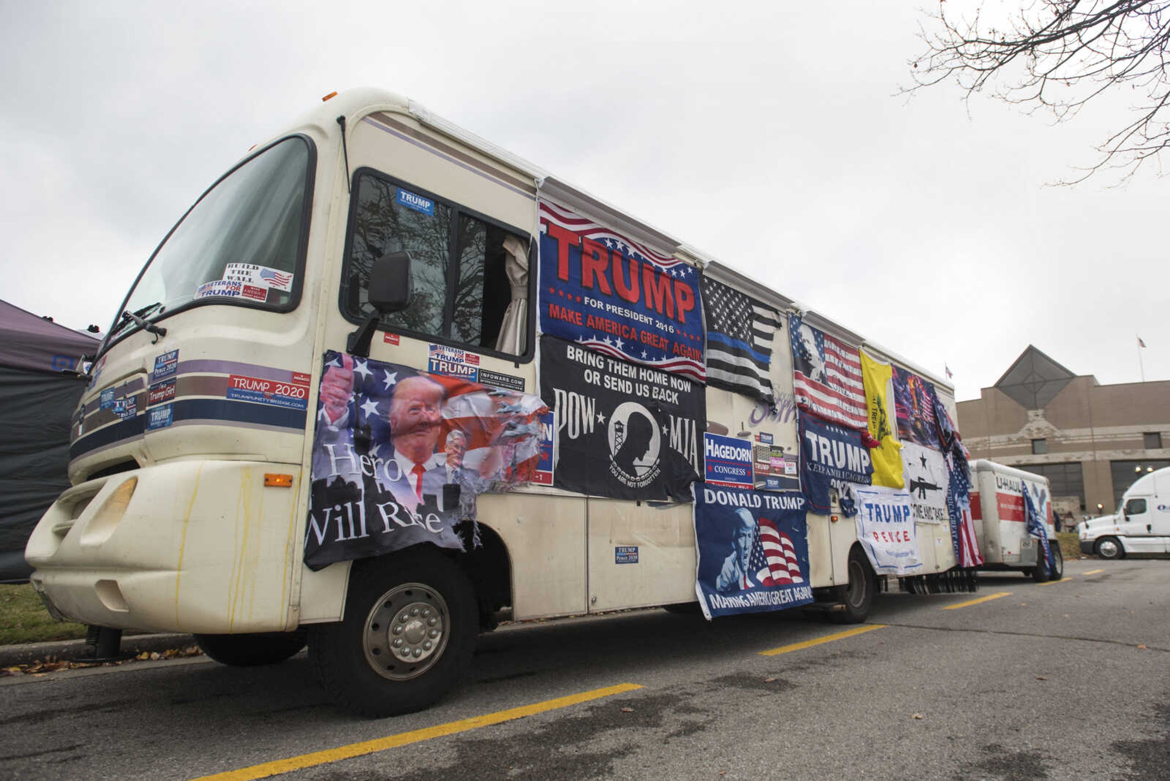 Trump flags cover the side of an RV in the parking lot of the Show Me Center before a Make America Great Again rally Monday, Nov. 5, 2018, in Cape Girardeau.