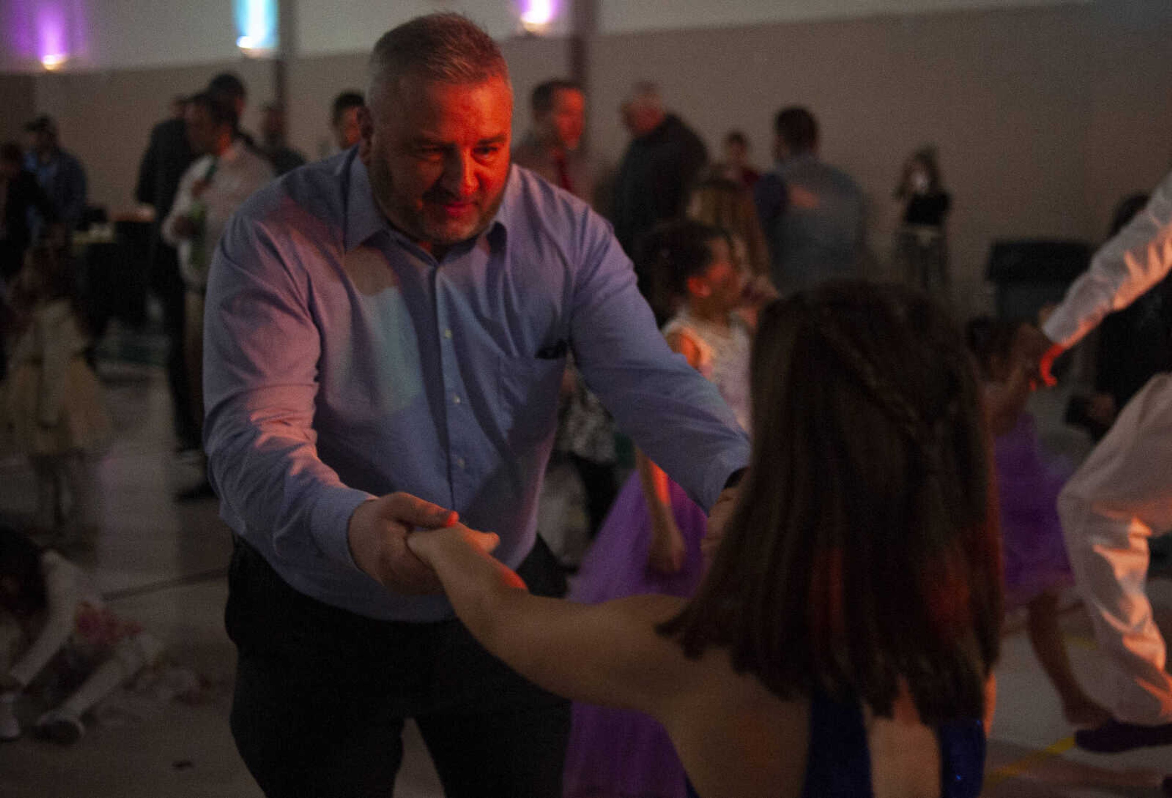 Scott Roth of Cape Girardeau dances with his daughter Bree Roth, 9, during the 11th annual Father Daughter Dance on Saturday, Feb. 16, 2019, at Osage Centre in Cape Girardeau.&nbsp;