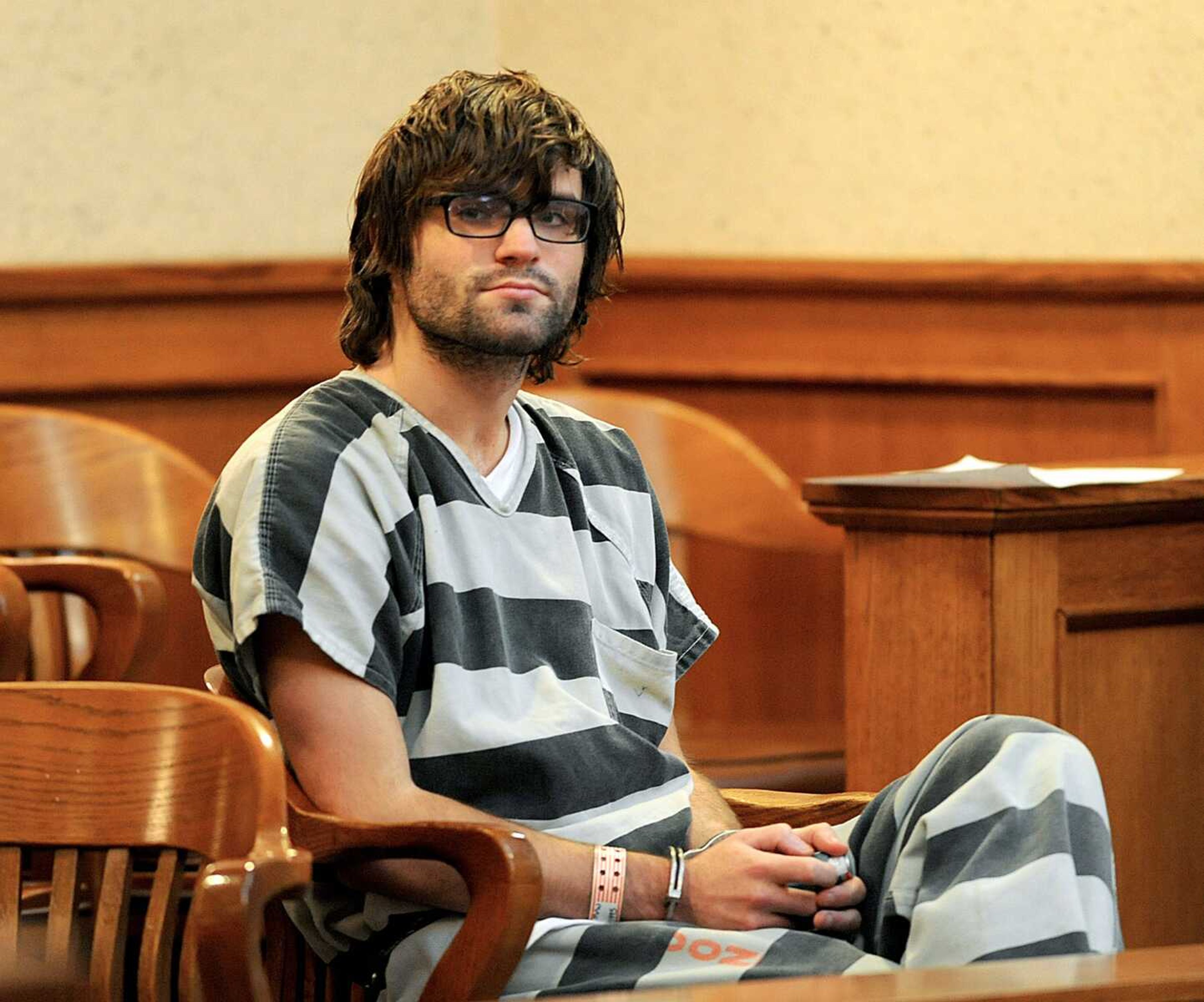 Hunter Michael Park, 19, left, waits in the Boone County Courthouse Division 5 to appear before Associate Circuit Judge Kim Shaw to have his bond set Wednesday in Columbia, Missouri. (Columbia Daily Tribune)