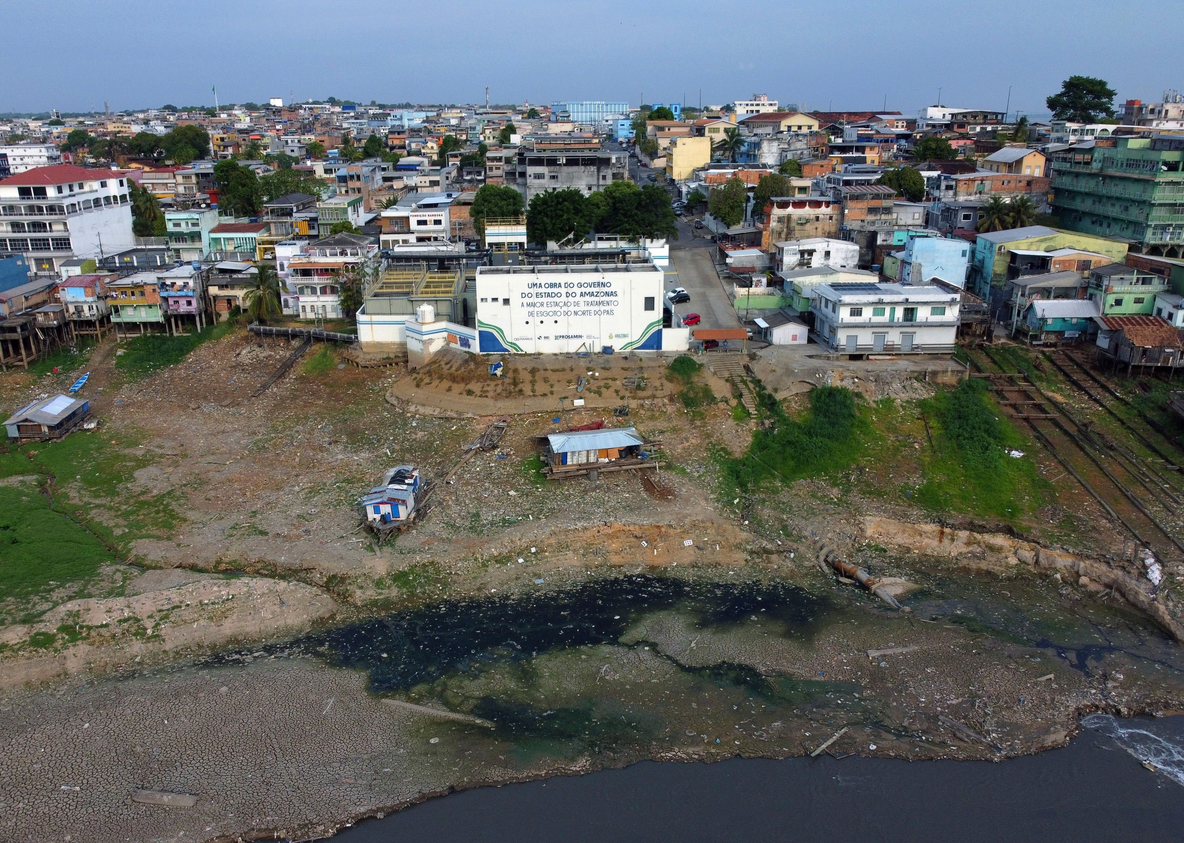 Part of the Educandos that connects to the Negro River is visible amid a severe drought in Manaus, state of Amazonas, Brazil, Wednesday, Sept. 25, 2024. (AP Photo/Edmar Barros)