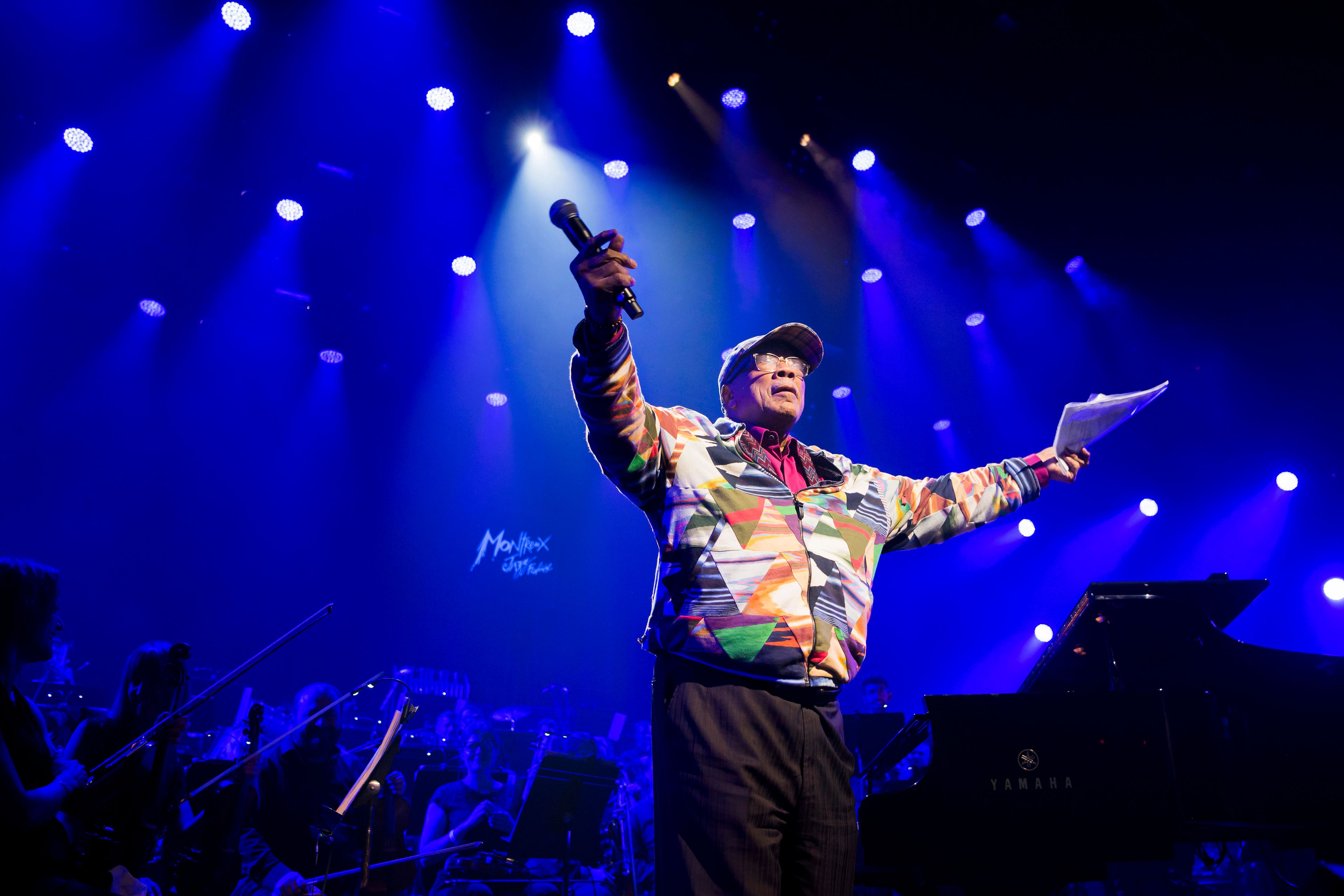 FILE - U.S. music producer Quincy Jones reacts during the Quincy Jones soundtrack of the 80's celebration evening at the Auditorium Stravinski during the 53rd Montreux Jazz Festival (MJF), in Montreux, Switzerland, Saturday, July 13, 2019. Quincy Jones has died at age 91. (Jean-Christophe Bott/Keystone via AP, File)